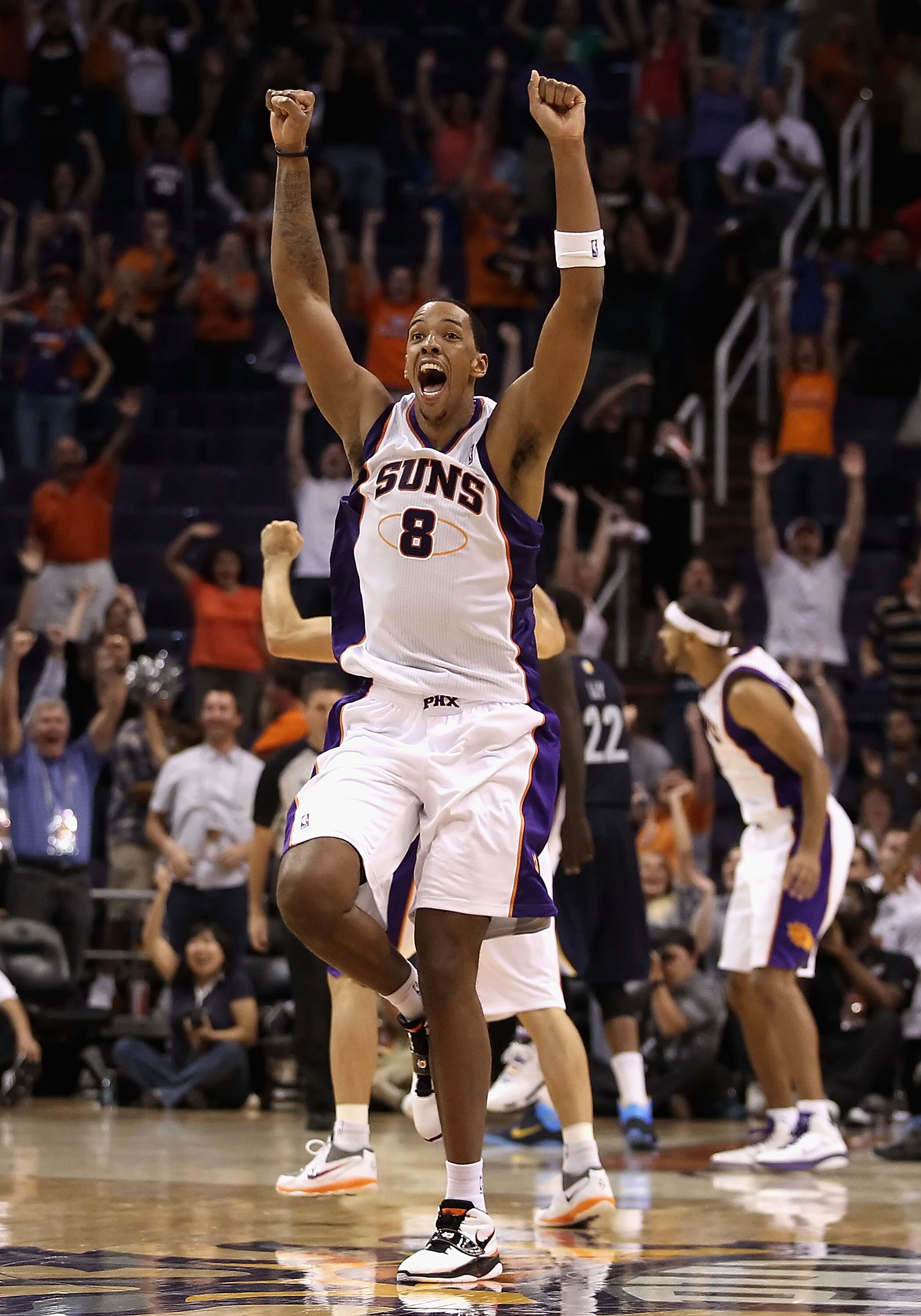 PHOENIX - NOVEMBER 05:  Channing Frye #8 of the Phoenix Suns celebrates after Jason Richardson (not pictured) tied the game in the final seconds to force overtime against the Memphis Grizzlies during the NBA game at US Airways Center on November 5, 2010 i