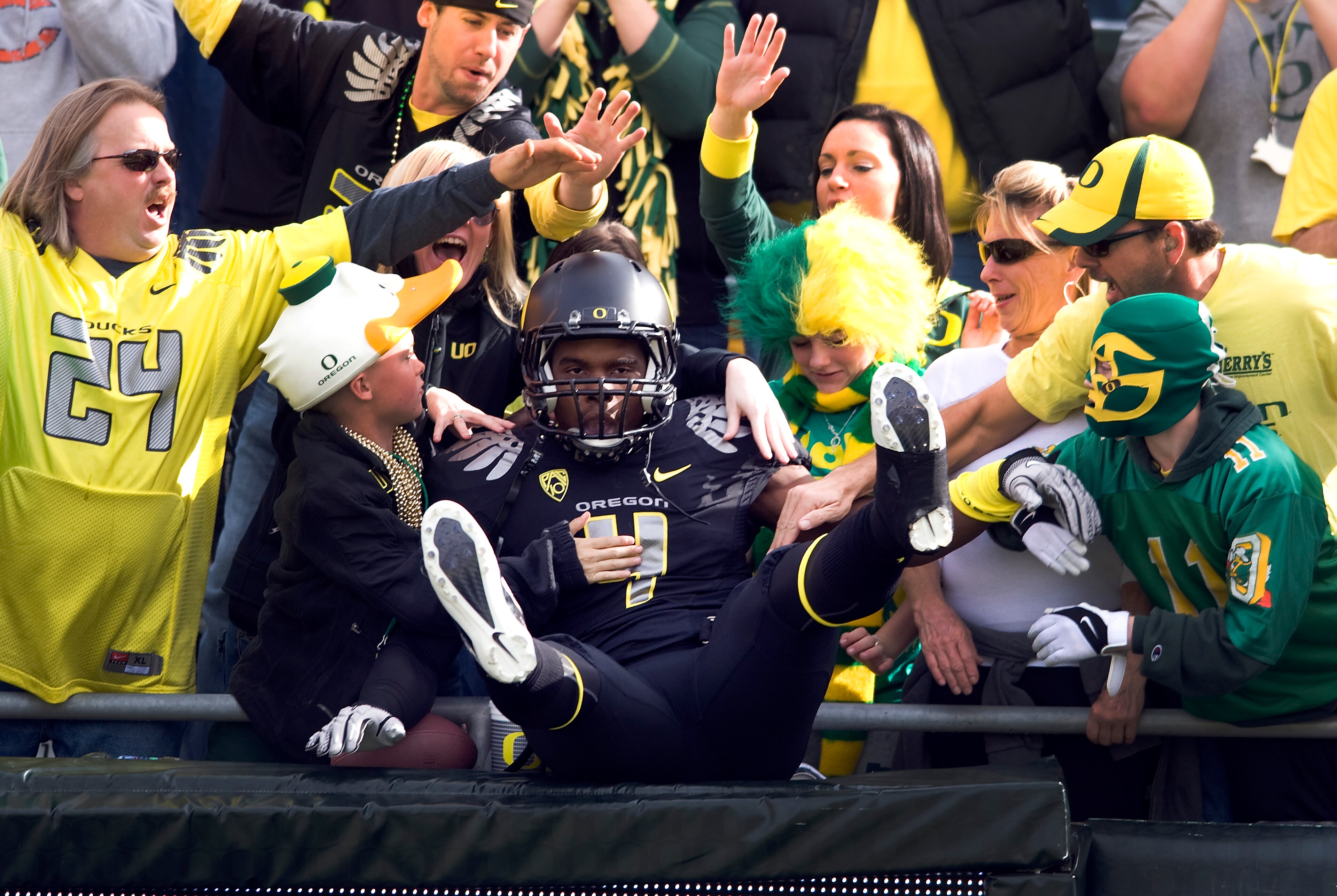 EUGENE, OR - NOVEMBER 06: Wide receiver Josh Huff #4 of the Oregon Ducks jumps into the crowd during the team introductions before the game against the Washington Huskies at Autzen Stadium on November 6, 2010 in Eugene, Oregon. The Ducks won the game 53-1