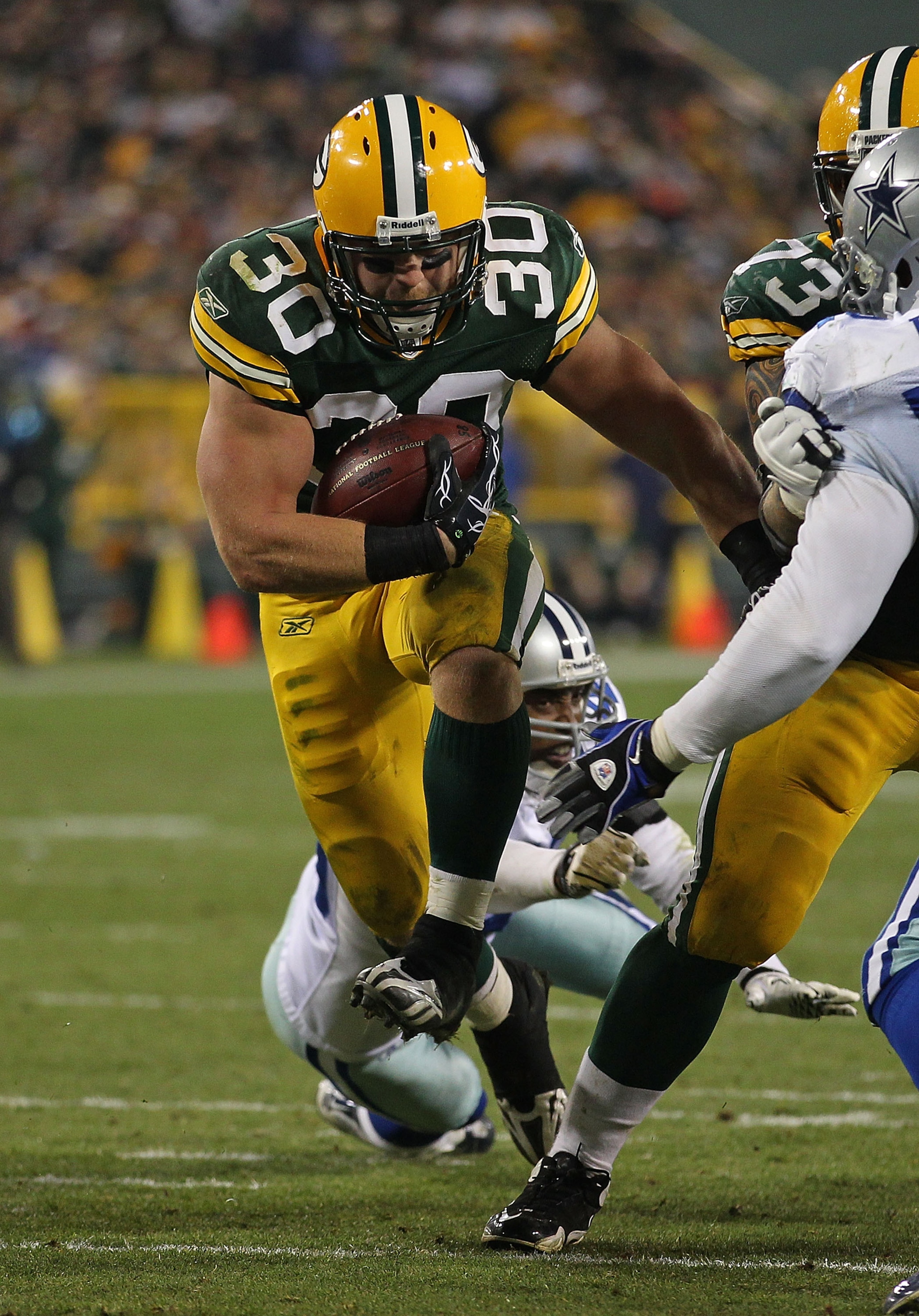 GREEN BAY, WI - NOVEMBER 07: John Kuhn #30 of the Green Bay Packers runs against the Dallas Cowboys at Lambeau Field on November 7, 2010 in Green Bay, Wisconsin. (Photo by Jonathan Daniel/Getty Images)