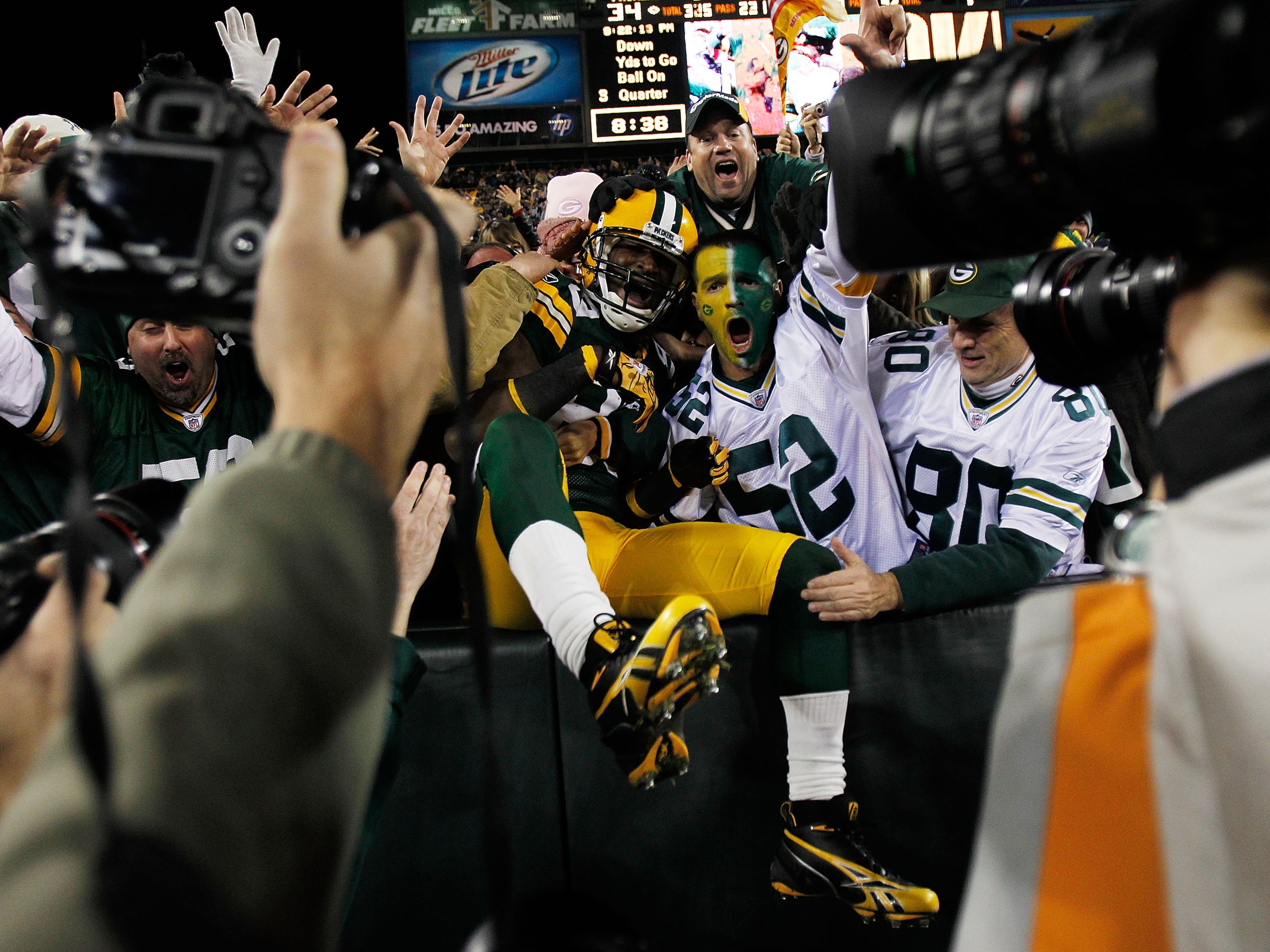 GREEN BAY, WI - NOVEMBER 07: James Jones #89 of the Green Bay Packers celebrates a touchdown with fans against the Dallas Cowboys at Lambeau Field on November 7, 2010 in Green Bay, Wisconsin. (Photo by Jonathan Daniel/Getty Images)
