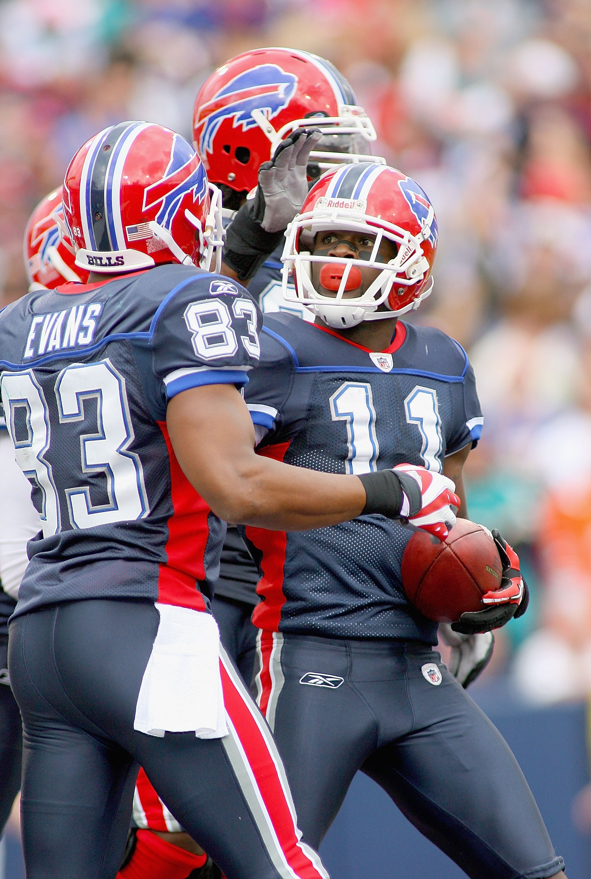 ORCHARD PARK, NY - SEPTEMBER 12: Roscoe Parrish #11 and Lee Evans #83 of the Buffalo Bills celebrate Parrish's touchdown against the Miami Dolphins during the NFL season opener at Ralph Wilson Stadium on September 12, 2010 in Orchard Park, New York. Miami