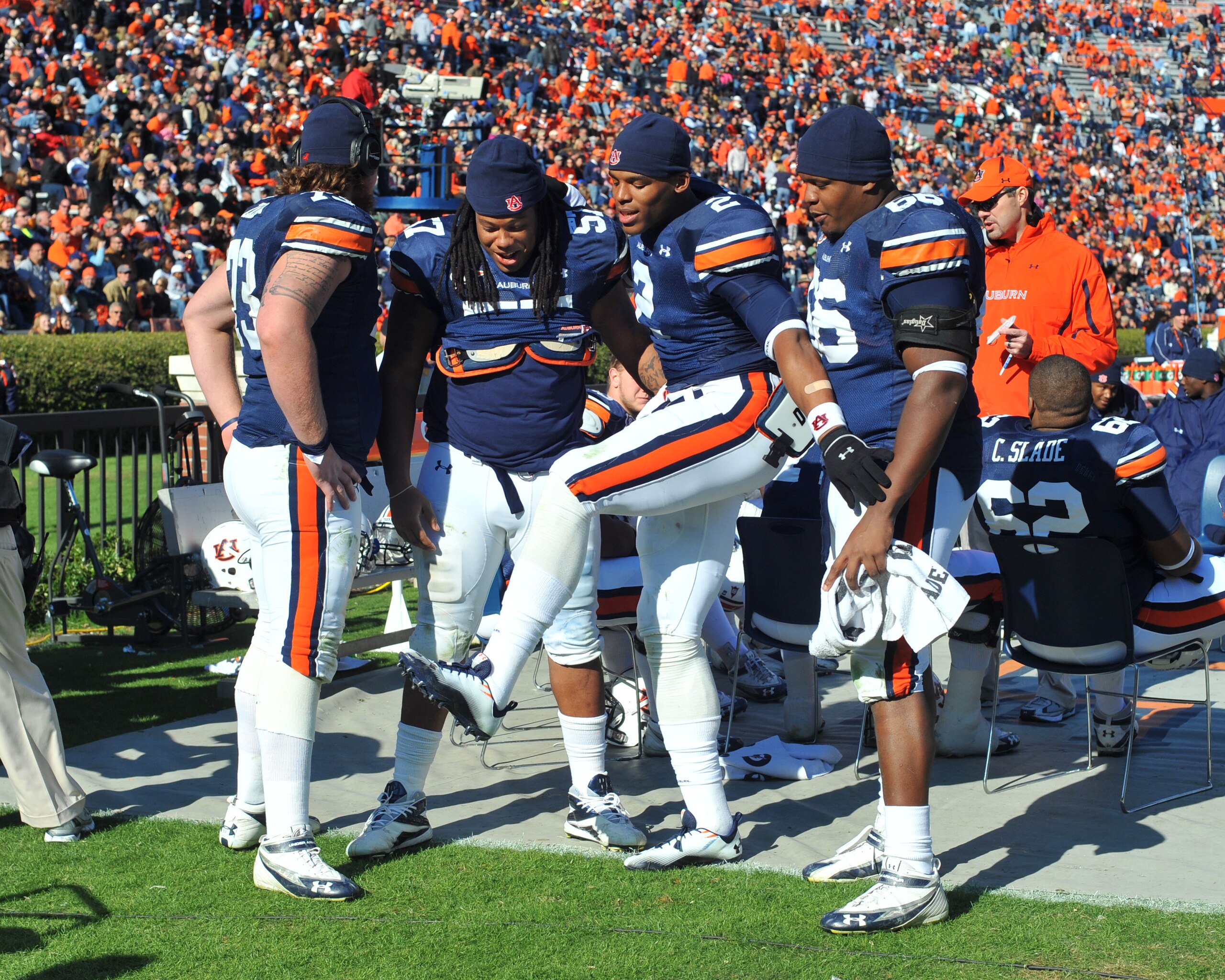AUBURN, AL - NOVEMBER 6: Quarterback Cam Newton #2 of the Auburn Tigers shows his teammates how he scored against the Chattanooga Mocs November 6, 2010 at Jordan-Hare Stadium in Auburn, Alabama. (Photo by Al Messerschmidt/Getty Images) AUBURN, AL - NOVEMBER 6: Quarterback Cam Newton #2 of the Auburn Tigers shows his teammates how he scored against the Chattanooga Mocs November 6, 2010 at Jordan-Hare Stadium in Auburn, Alabama. (Photo by Al Messerschmidt/Getty Images)