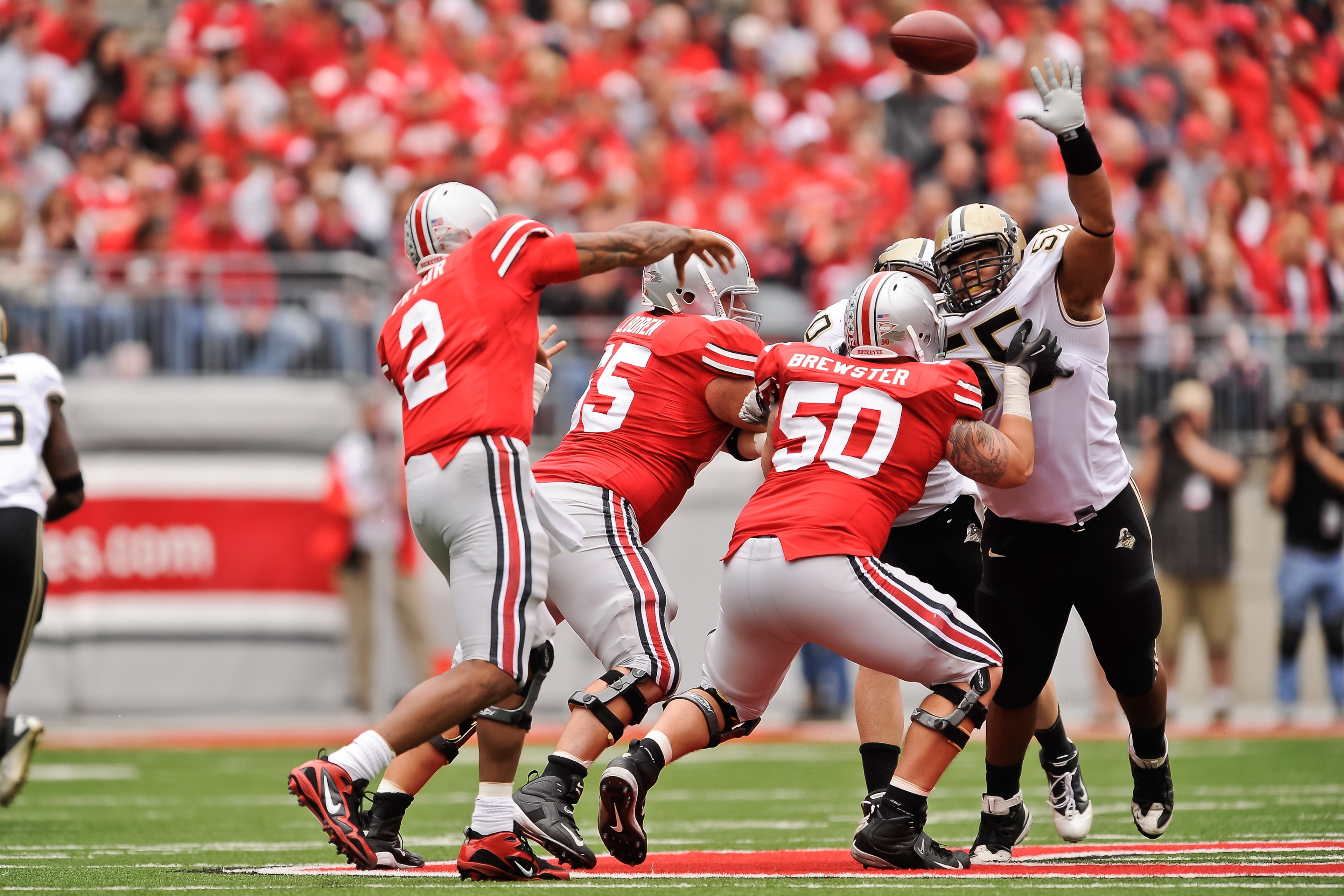 COLUMBUS, OH - OCTOBER 23:  Brandon Taylor #55 of the Purdue Boilermakers attempts to block a pass attempt by Terrelle Pryor #2 of the Ohio State Buckeyes at Ohio Stadium on October 23, 2010 in Columbus, Ohio.  (Photo by Jamie Sabau/Getty Images)