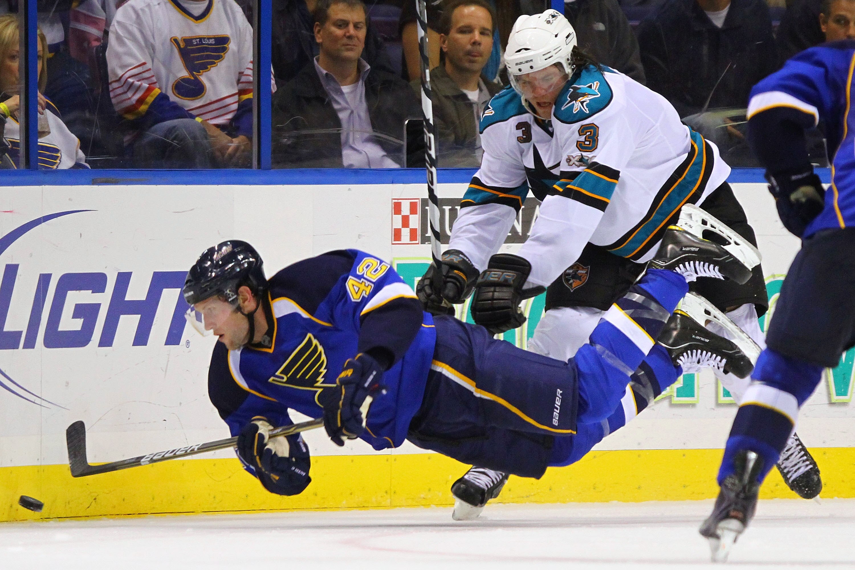 ST. LOUIS - NOVEMBER 4: Douglas Murray #3 of the San Jose Sharks pushes David Backes #42 of the St. Louis Blues to the ice at the Scottrade Center on November 4, 2010 in St. Louis, Missouri.  The Blues beat the Sharks 2-1.  (Photo by Dilip Vishwanat/Getty
