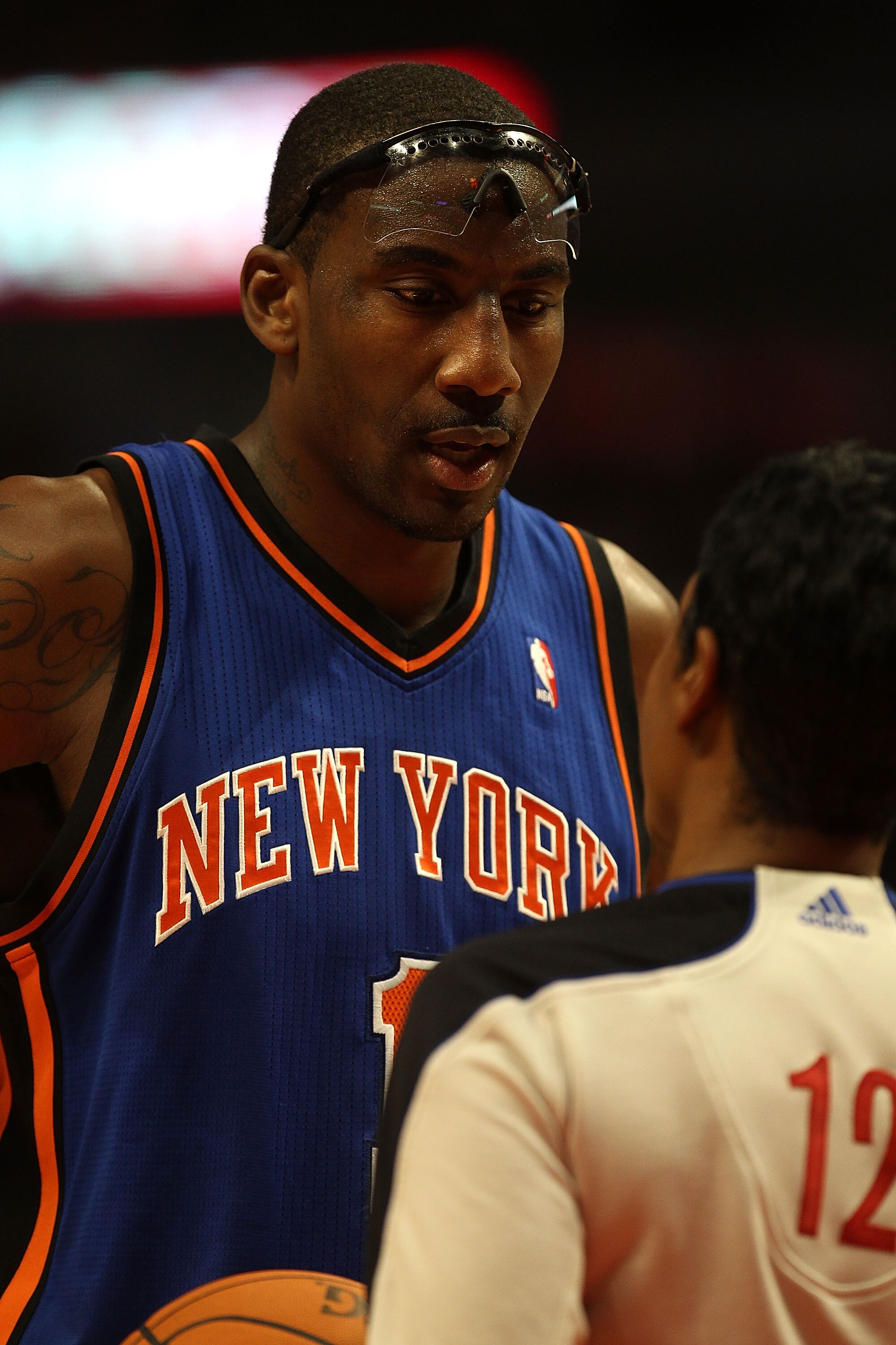 CHICAGO - NOVEMBER 04: Amar'e Stoudemire #1 of the New York Knicks talks with referee Violet Palmer #12 as he waits at the free-throw line during a game against the Chicago Bulls at the United Center on November 4, 2010 in Chicago, Illinois. The Knicks de