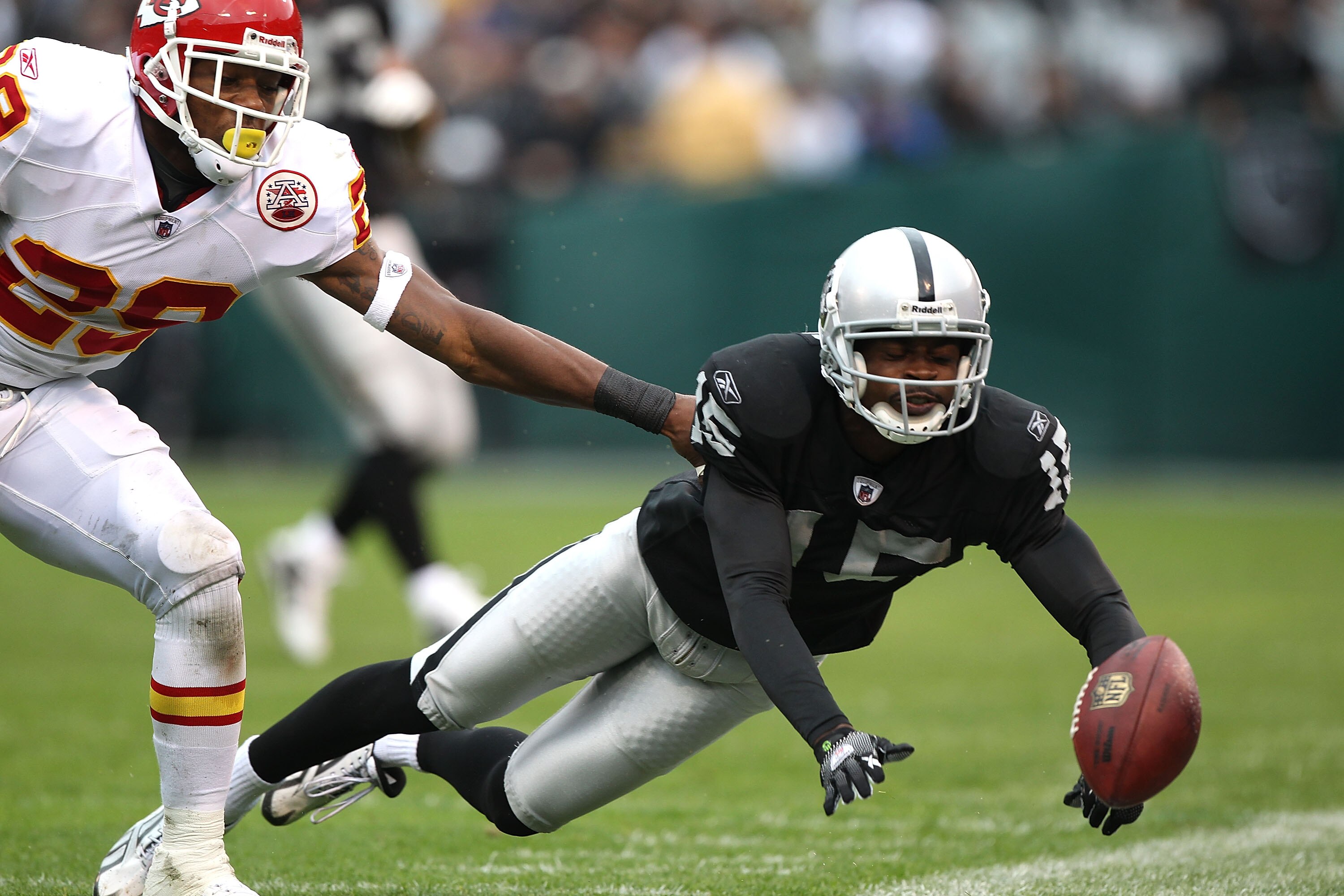 OAKLAND, CA - NOVEMBER 07:  Johnnie Lee Higgins #15 of the Oakland Raiders misses a pass against Eric Berry #29 of the Kansas City Chiefs during an NFL game at Oakland-Alameda County Coliseum on November 7, 2010 in Oakland, California.  (Photo by Jed Jaco