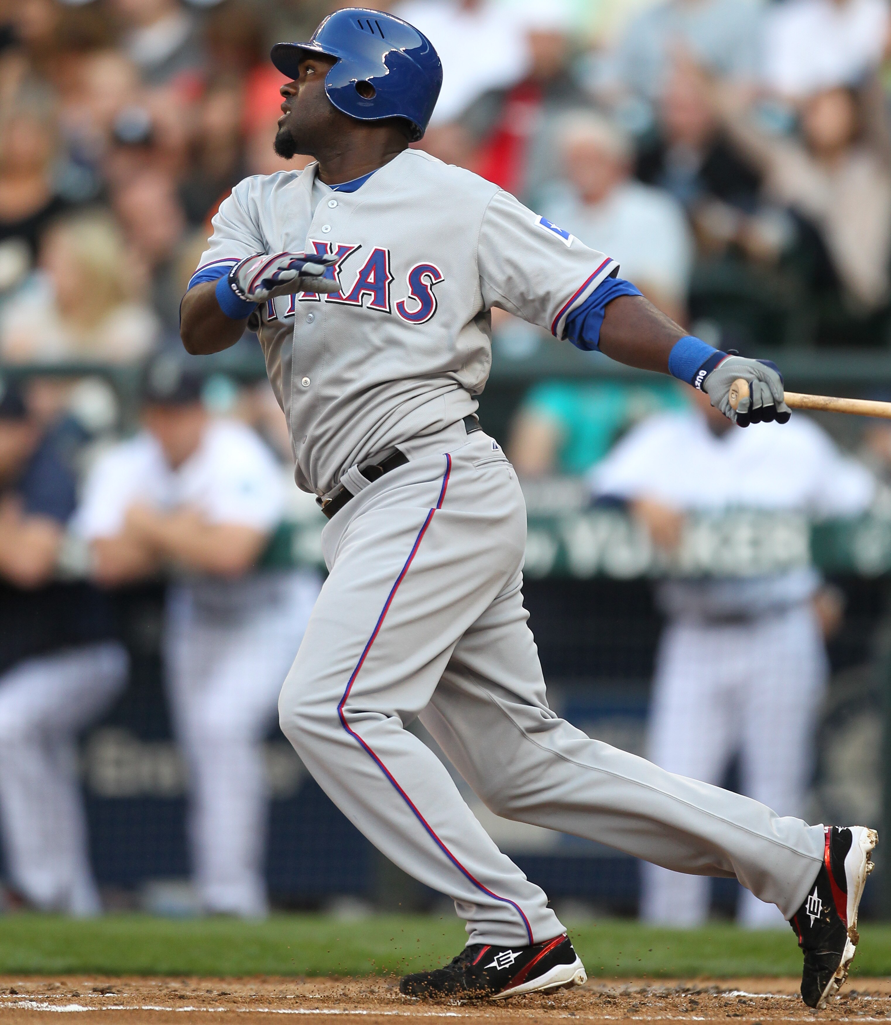SEATTLE - AUGUST 03:  Cristian Guzman #12 of the Texas Rangers bats against the Seattle Mariners at Safeco Field on August 3, 2010 in Seattle, Washington. (Photo by Otto Greule Jr/Getty Images)
