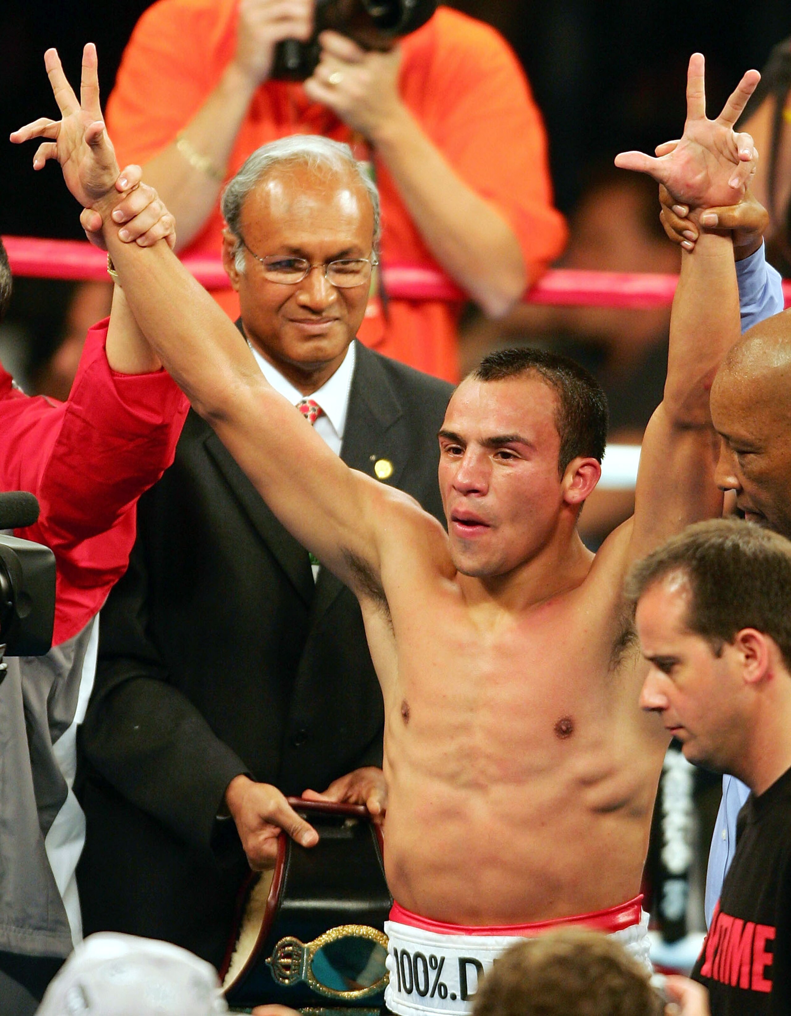 LAS VEGAS - MAY 7:  Juan Manuel Marquez celebrates defeating Victor Polo during their bout on May 7, 2005 at The Mandalay Bay in Las Vegas, Nevada. Juan Manuel Marquez won by points after  twelve rounds.  (Photo by Nick Laham/Getty Images)