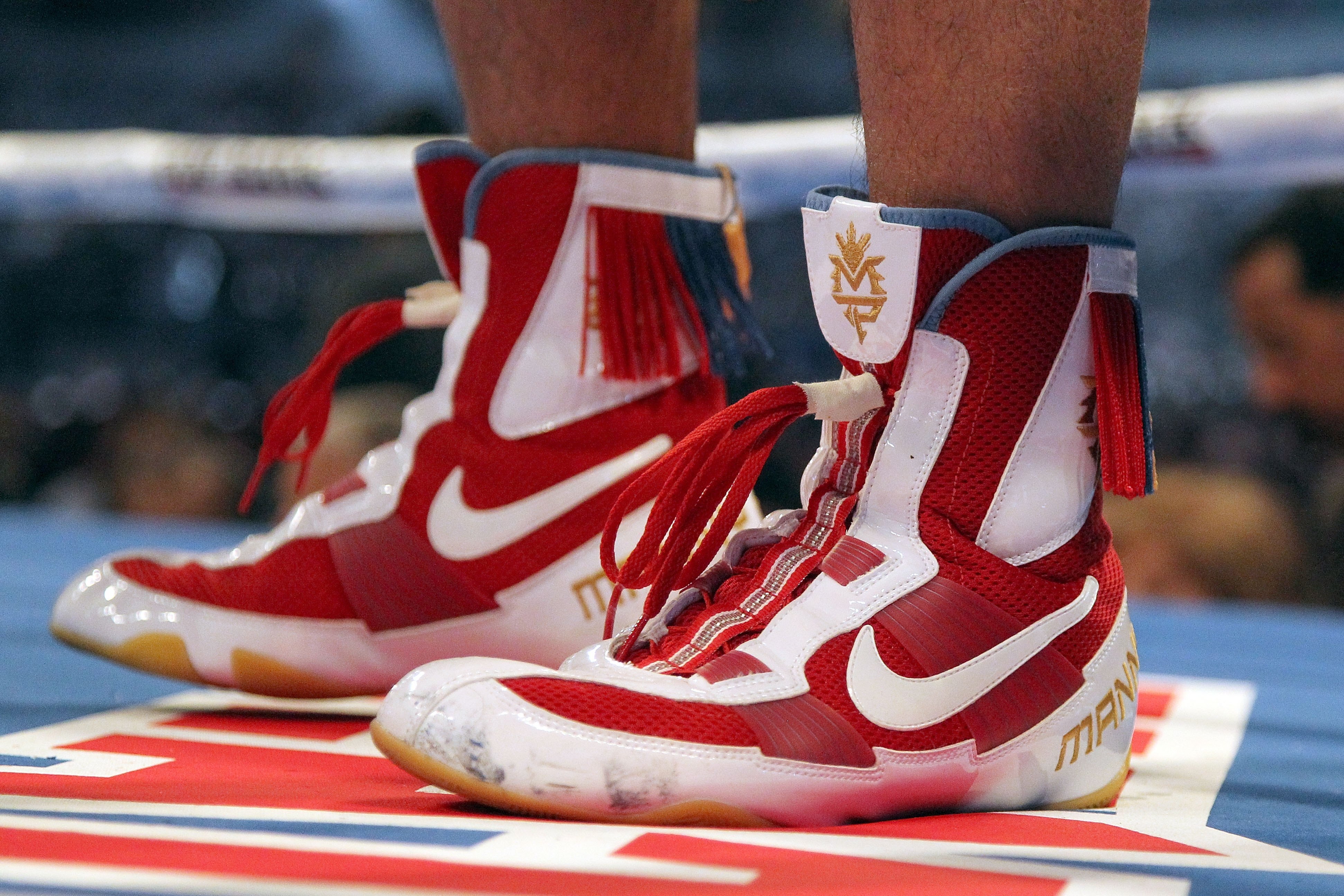 ARLINGTON, TX - MARCH 13: A detail of the Nike boxing shoes of Manny Pacquiao of the Philippines in the ring against Joshua Clottey of Ghana during the WBO welterweight title fight at Cowboys Stadium on March 13, 2010 in Arlington, Texas. Pacquiao defeate