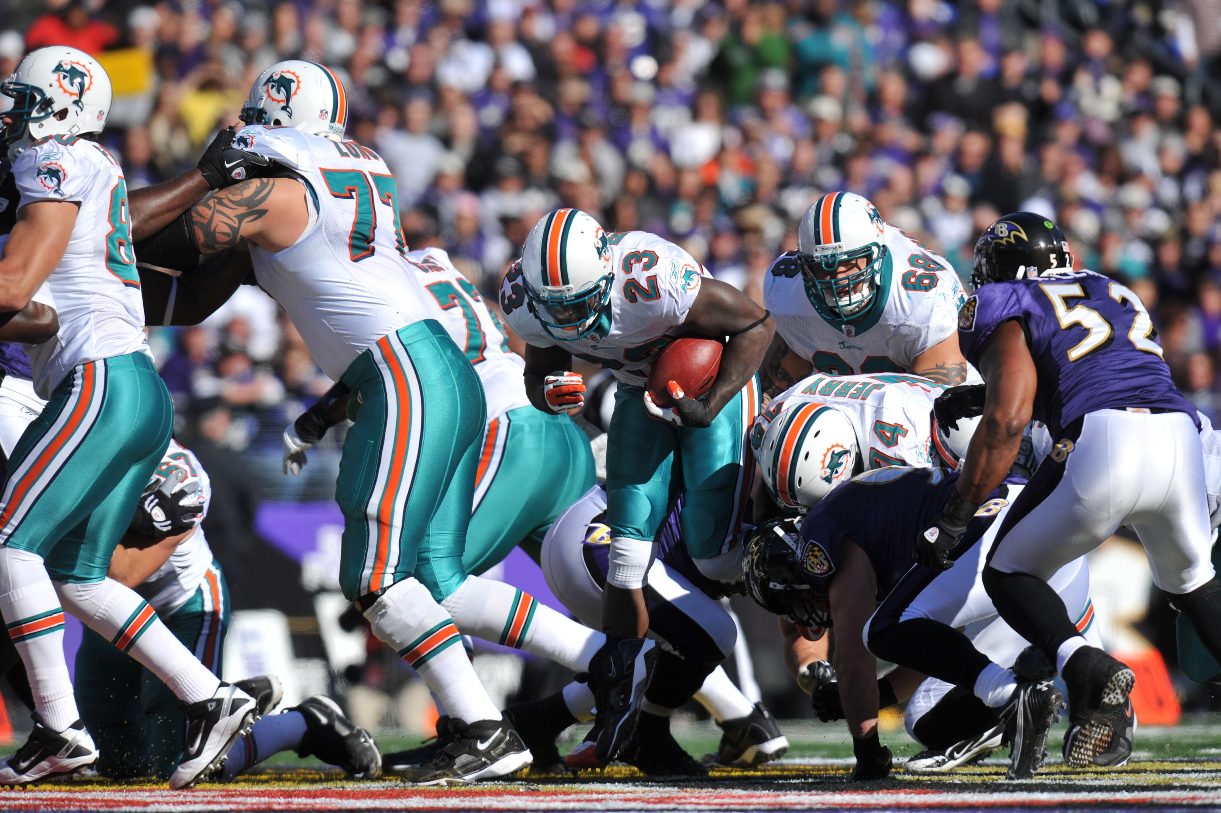 BALTIMORE, MD - NOVEMBER 7:  Ronnie Brown #23 of the Miami Dolphins runs the ball against the Baltimore Ravens at M&T Bank Stadium on November 7, 2010 in Baltimore, Maryland. The Ravens defeated the Dolphins 26-10. (Photo by Larry French/Getty Images)