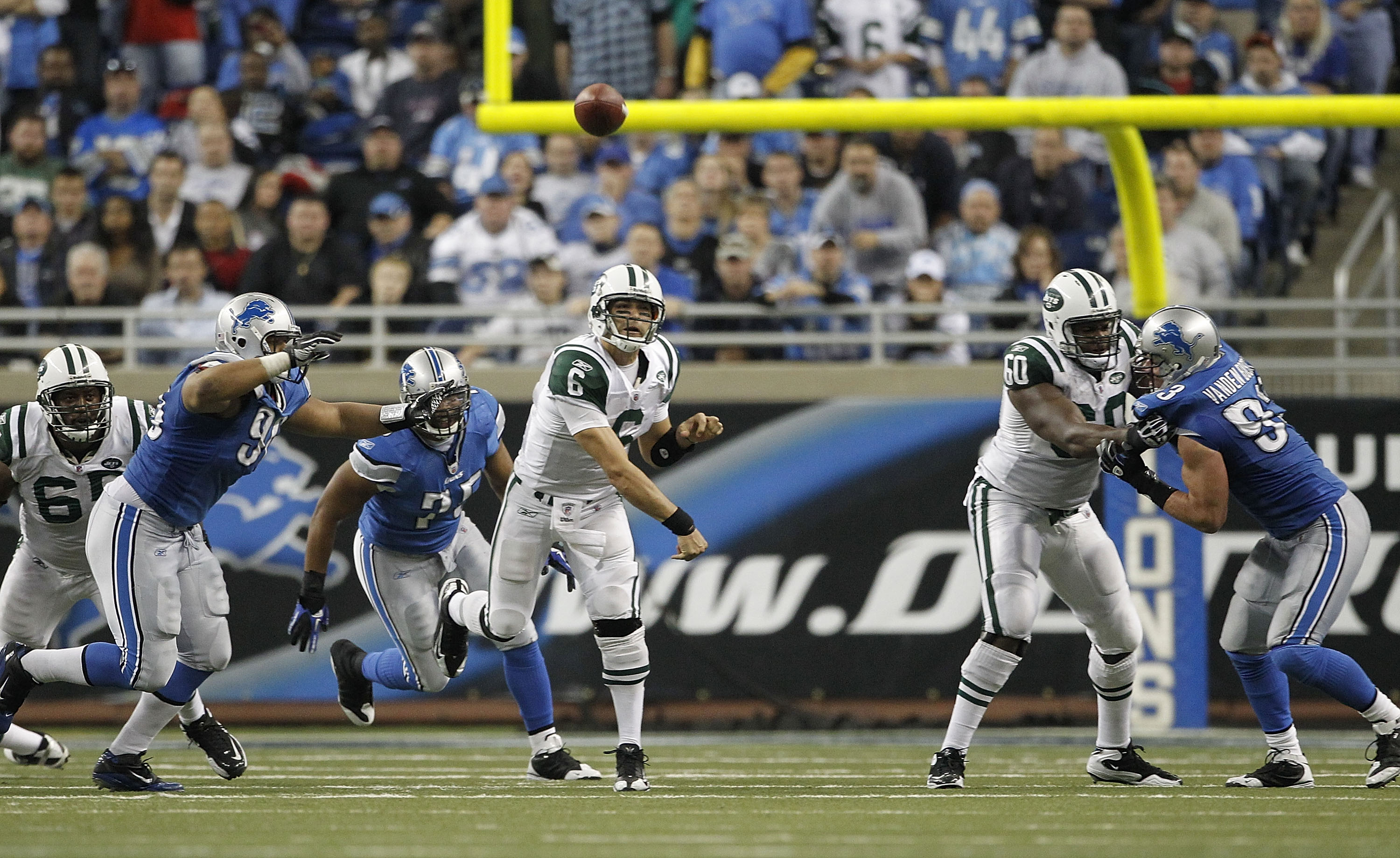 DETROIT - NOVEMBER 07: Mark Sanchez #6 of the New York Jets throws a pass during the overtime period of the game against the Detroit Lions at Ford Field on November 7, 2010 in Detroit, Michigan. The Jets defeated the Lions 23-20 in overtime.  (Photo by Le