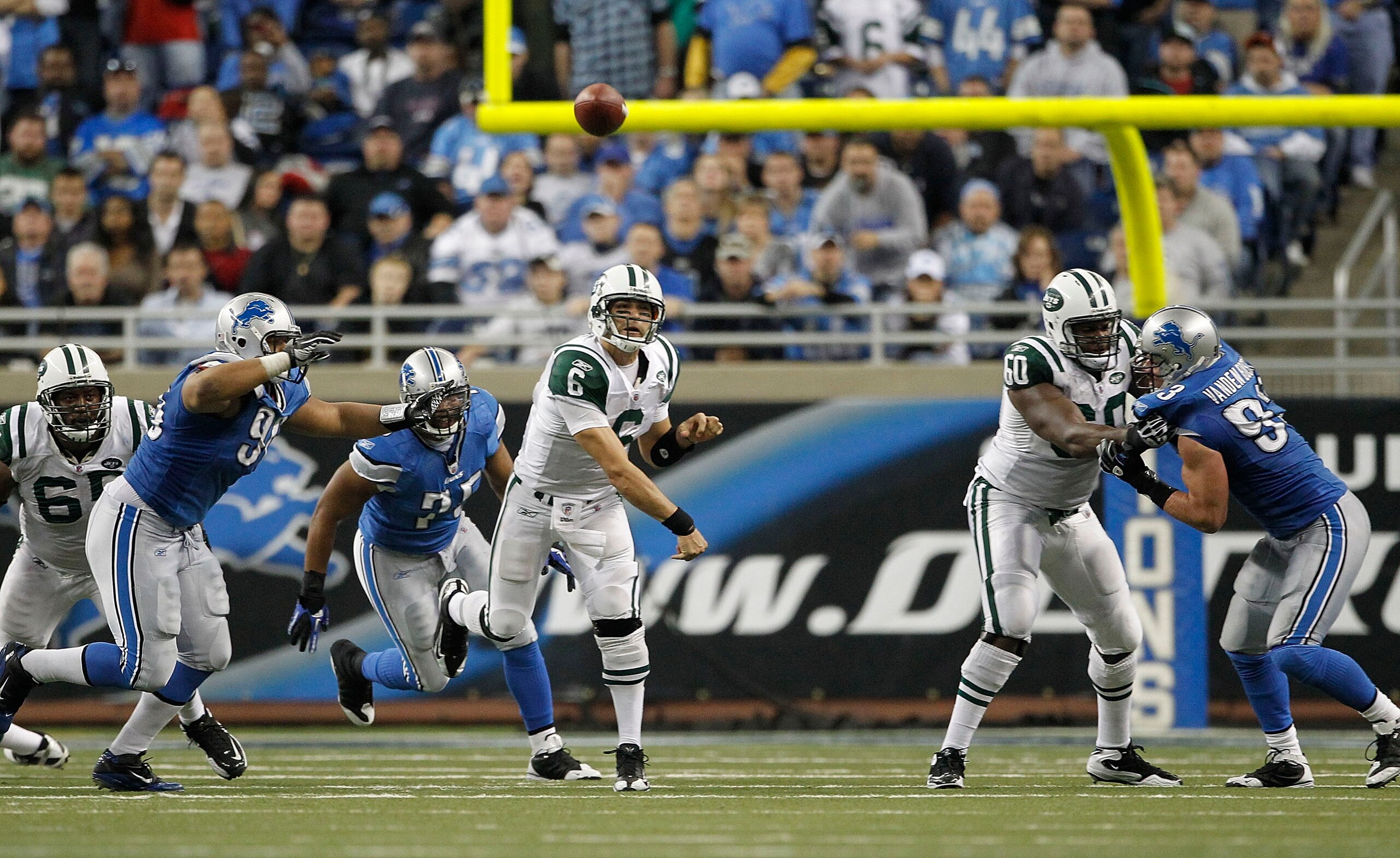 DETROIT - NOVEMBER 07: Mark Sanchez #6 of the New York Jets throws a pass during the overtime period of the game against the Detroit Lions at Ford Field on November 7, 2010 in Detroit, Michigan. The Jets defeated the Lions 23-20 in overtime.  (Photo by Le
