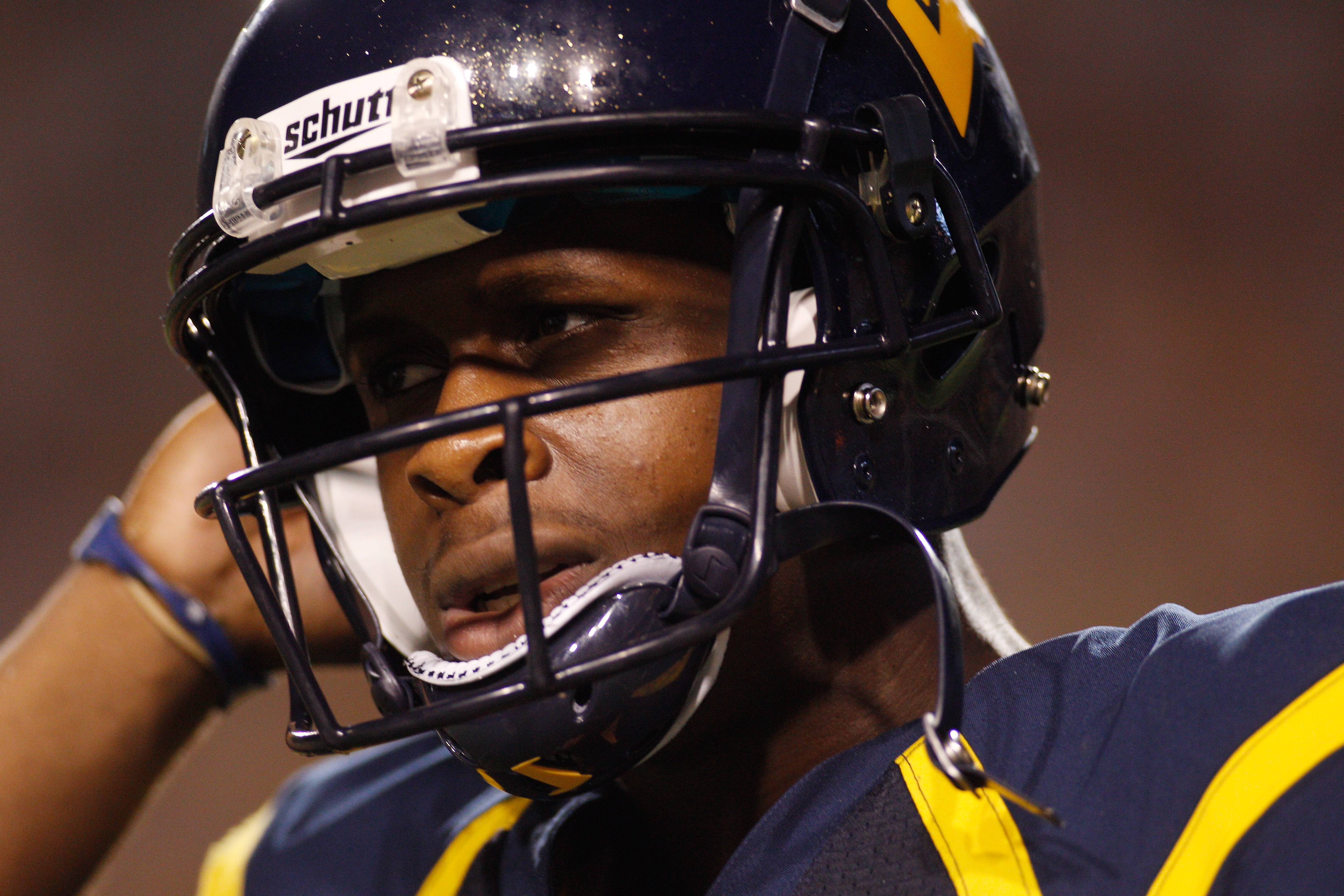 BATON ROUGE, LA - SEPTEMBER 25:  Quarterback Geno Smith #12 of the West Virginia Mountaineers walks off the field after a play against the Louisiana State University Tigers at Tiger Stadium on September 25, 2010 in Baton Rouge, Louisiana.  The Tigers defe