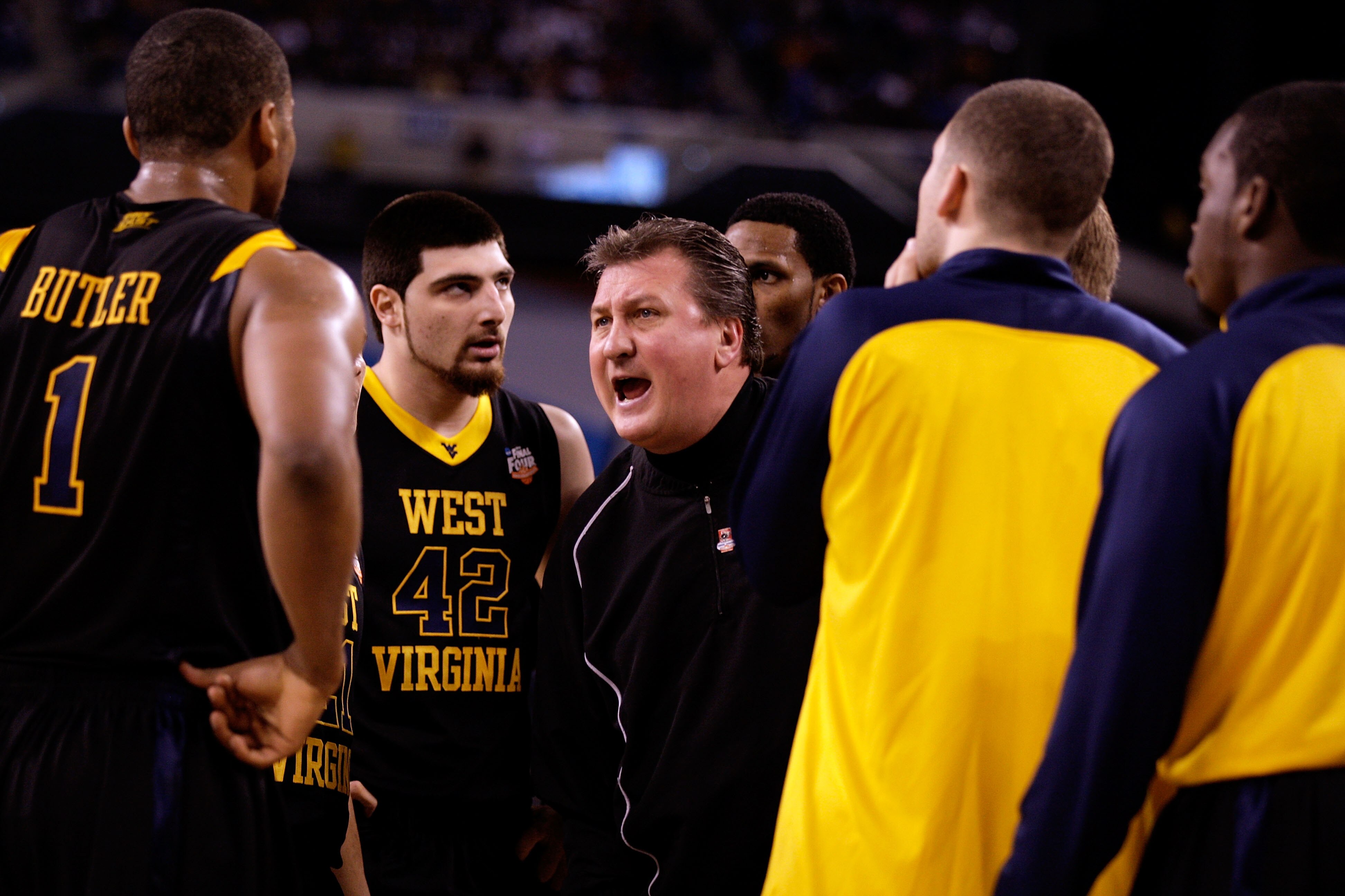 INDIANAPOLIS - APRIL 03:  Head coach Bob Huggins of the West Virginia Mountaineers yells at his players during a timeout in the first half against the Duke Blue Devils during the National Semifinal game of the 2010 NCAA Division I Men's Basketball Champio