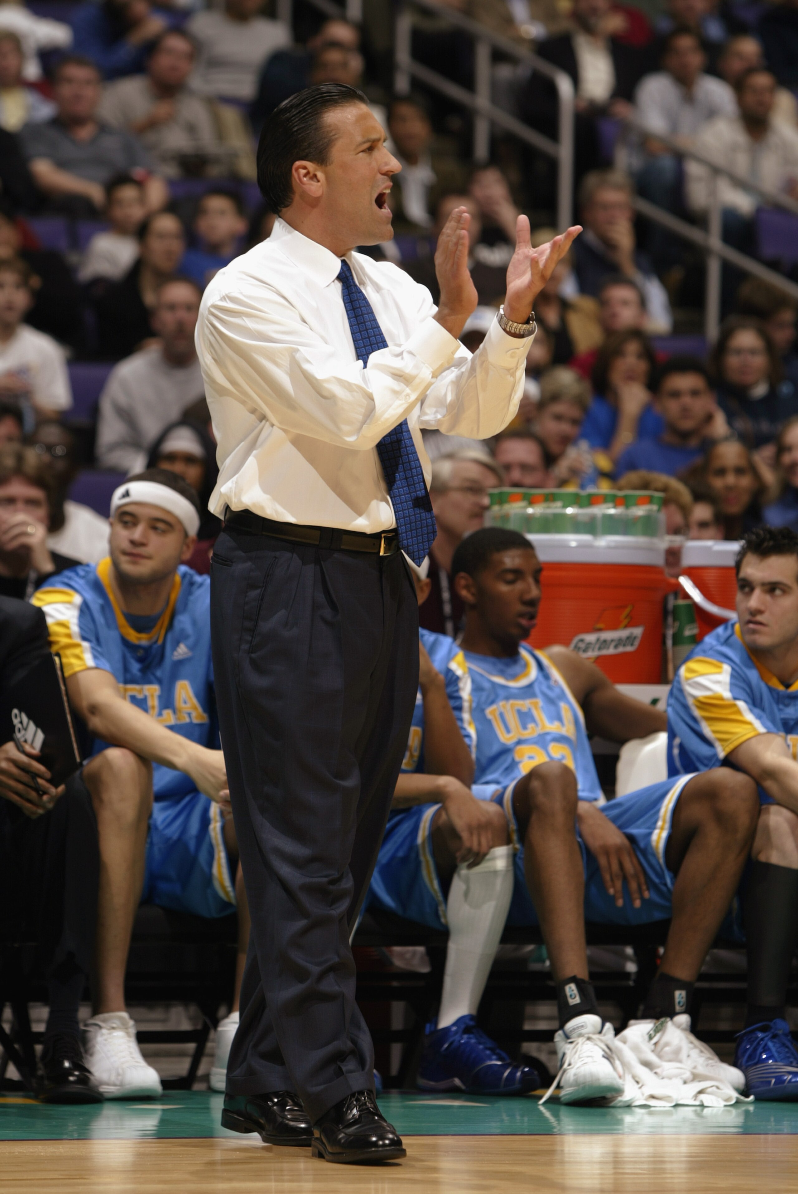 LOS ANGELES - MARCH 14:  UCLA head coach Steve Lavin encourages his team during the NCAA Pac-10 Conference tournament semifinals game against Oregon at the Staples Center on March 14, 2003 in Los Angeles, California.  In what could be Lavin's last game at
