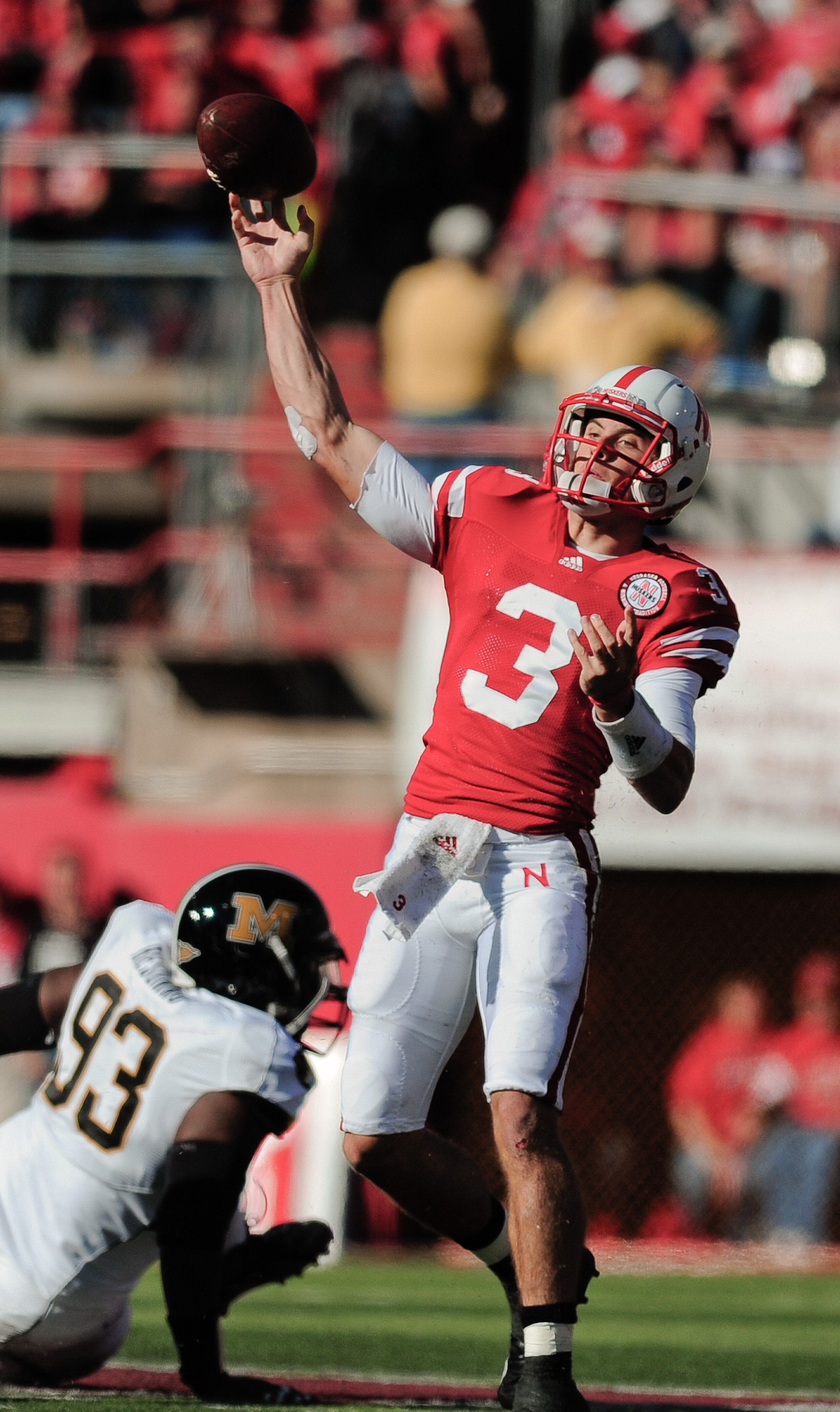LINCOLN, NE - OCTOBER 30: Quarterback Taylor Martinez #3 of the Nebraska Cornhuskers throw downfield during first half action of their game at Memorial Stadium on October 30, 2010 in Lincoln, Nebraska. Nebraska Defeated Missouri 31-17. (Photo by Eric Fran