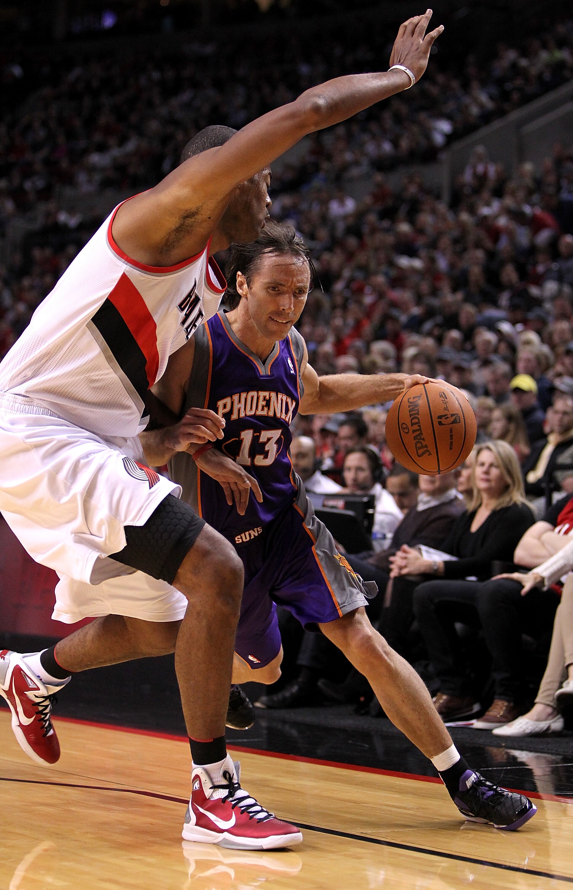 PORTLAND, OR - OCTOBER 26:  Steve Nash #13 of the Phoenix Suns drives with the ball agianst Marcus Camby #23 of the Portland Trail Blazers on October 26, 2010 at the Rose Garden in Portland, Oregon.  NOTE TO USER: User expressly acknowledges and agrees th