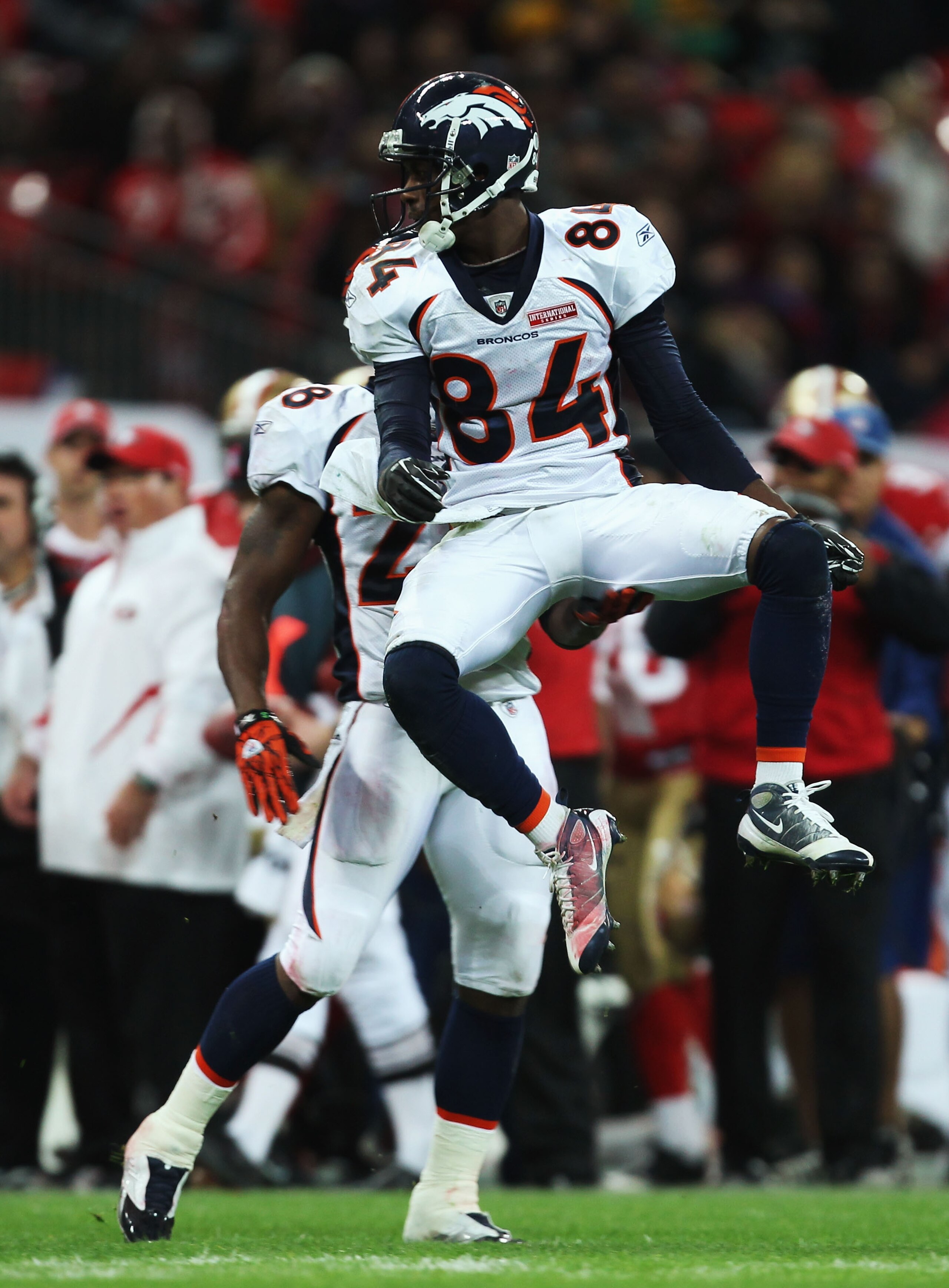 LONDON, ENGLAND - OCTOBER 31:  Brandon Lloyd #84 of Denver Broncos celebrates with Correll Buckhalter #28 of Denver Broncos during the NFL International Series match between Denver Broncos and San Francisco 49ers at Wembley Stadium on October 31, 2010 in