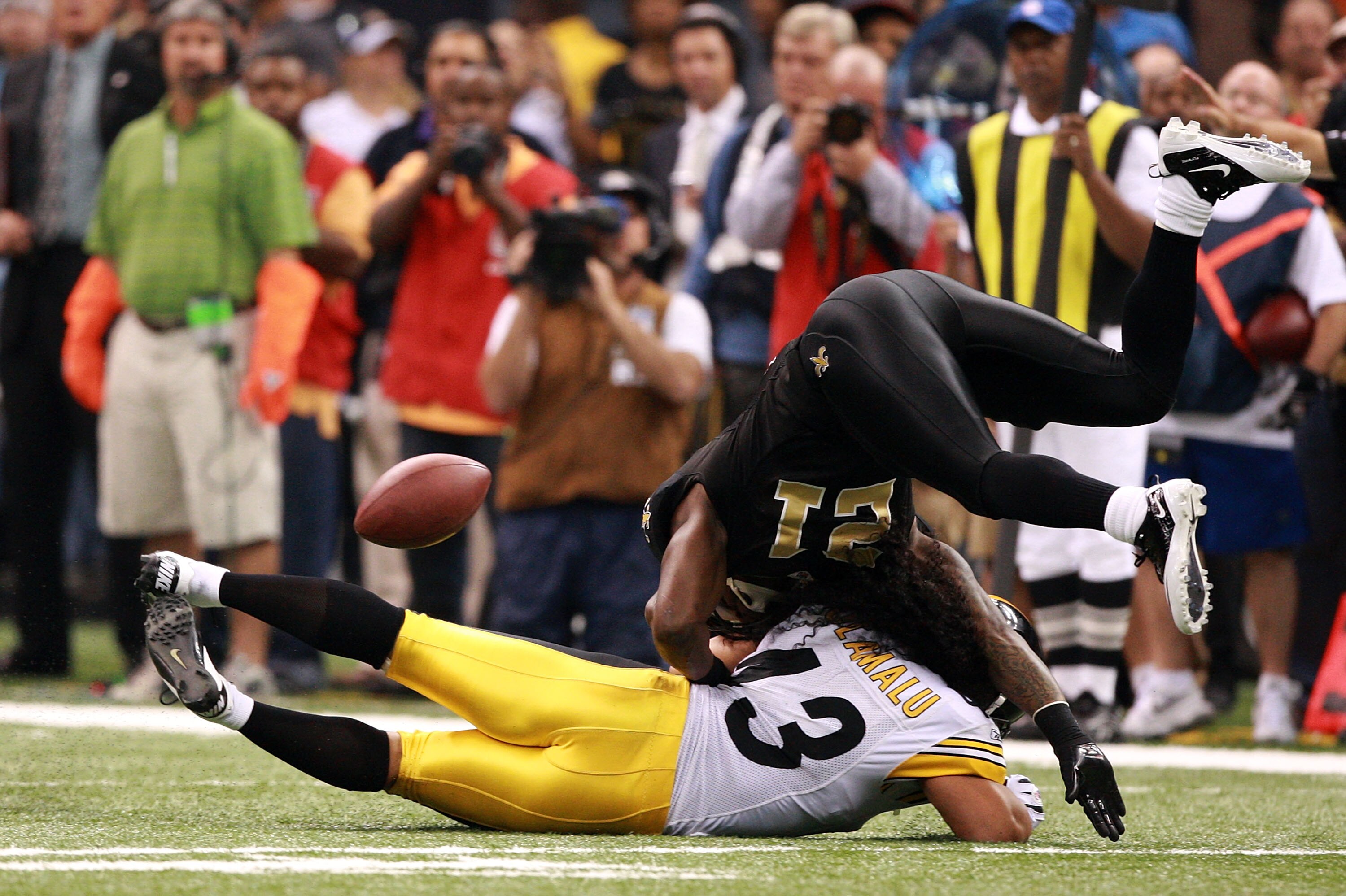 NEW ORLEANS - OCTOBER 31:  Julius Jones #21 of the New Orleans Saints is tackled byTroy Polamalu #43 of the Pittsburgh Steelers during their game at Louisiana Superdome on October 31, 2010 in New Orleans, Louisiana.  The Saints won 20-10 over the Steelers