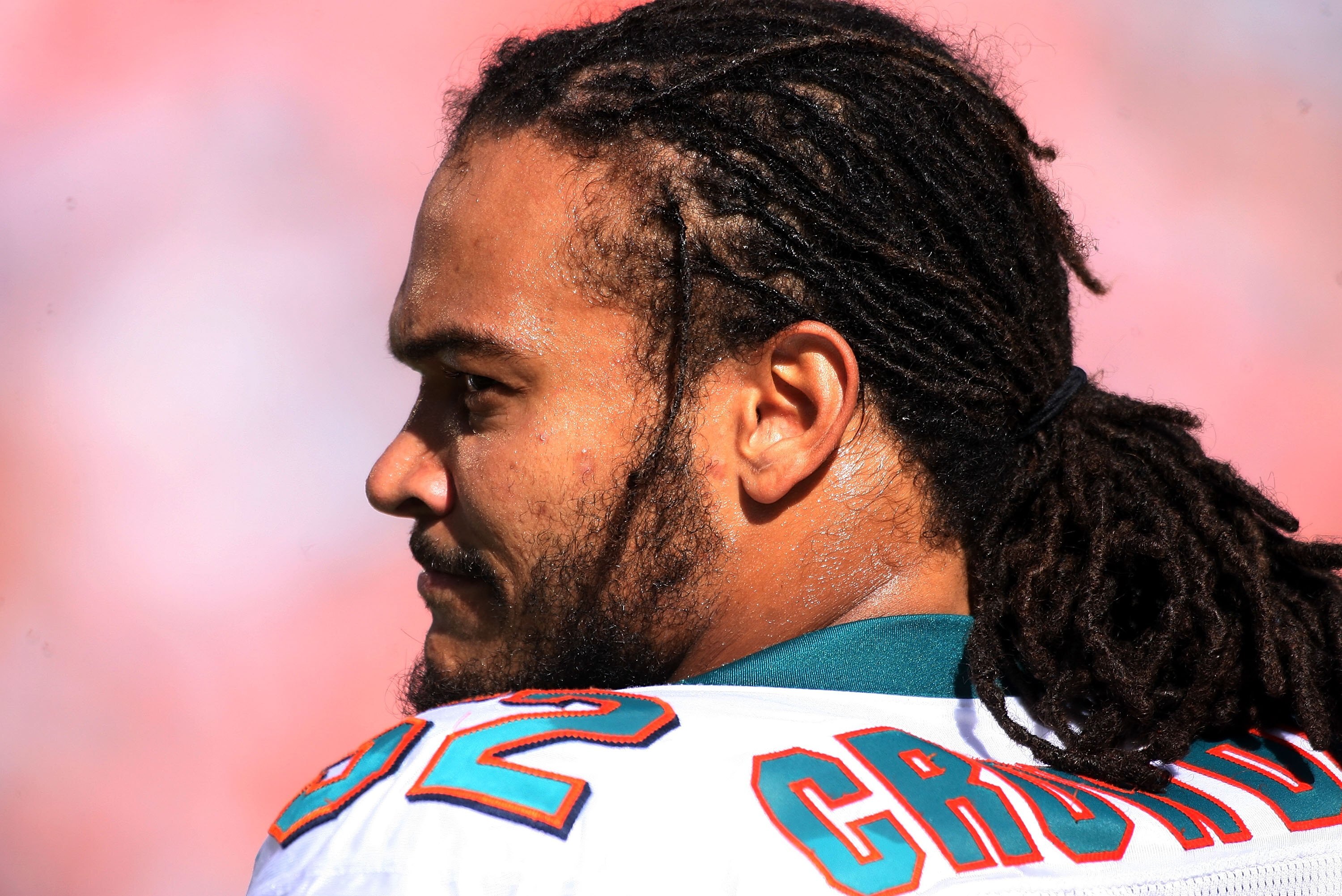 MIAMI - OCTOBER 04:  Linebacker Channing Crowder #52  of the Miami Dolphins looks on against the Buffalo Bills at Land Shark Stadium on October 4, 2009 in Miami, Florida. Miami defeated Buffalo 31-30.  (Photo by Marc Serota/Getty Images)