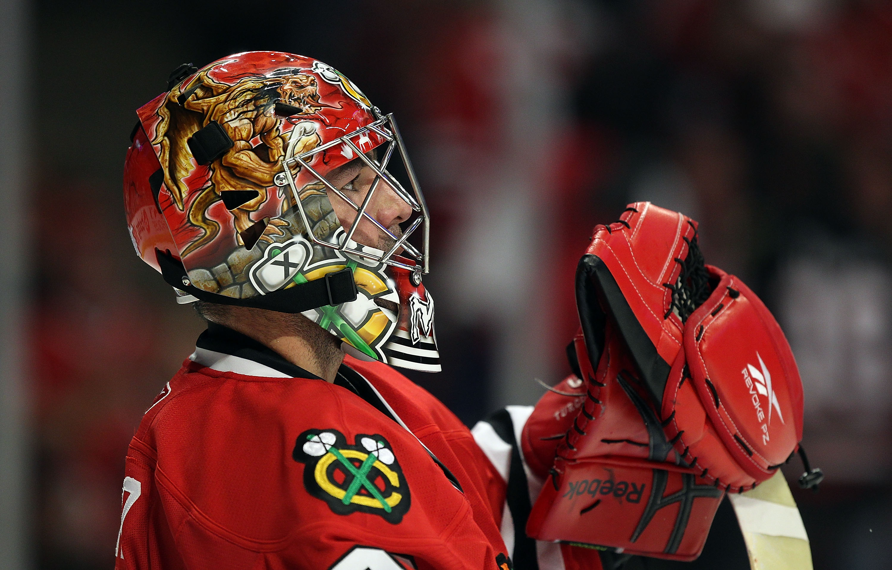 CHICAGO - OCTOBER 09: Marty Turco #30 of the Chicago Blackhawks takes a break in the action against the Detroit Red Wings during the Blackhawks season home opening game at the United Center on October 9, 2010 in Chicago, Illinois. The Red Wings defeated t