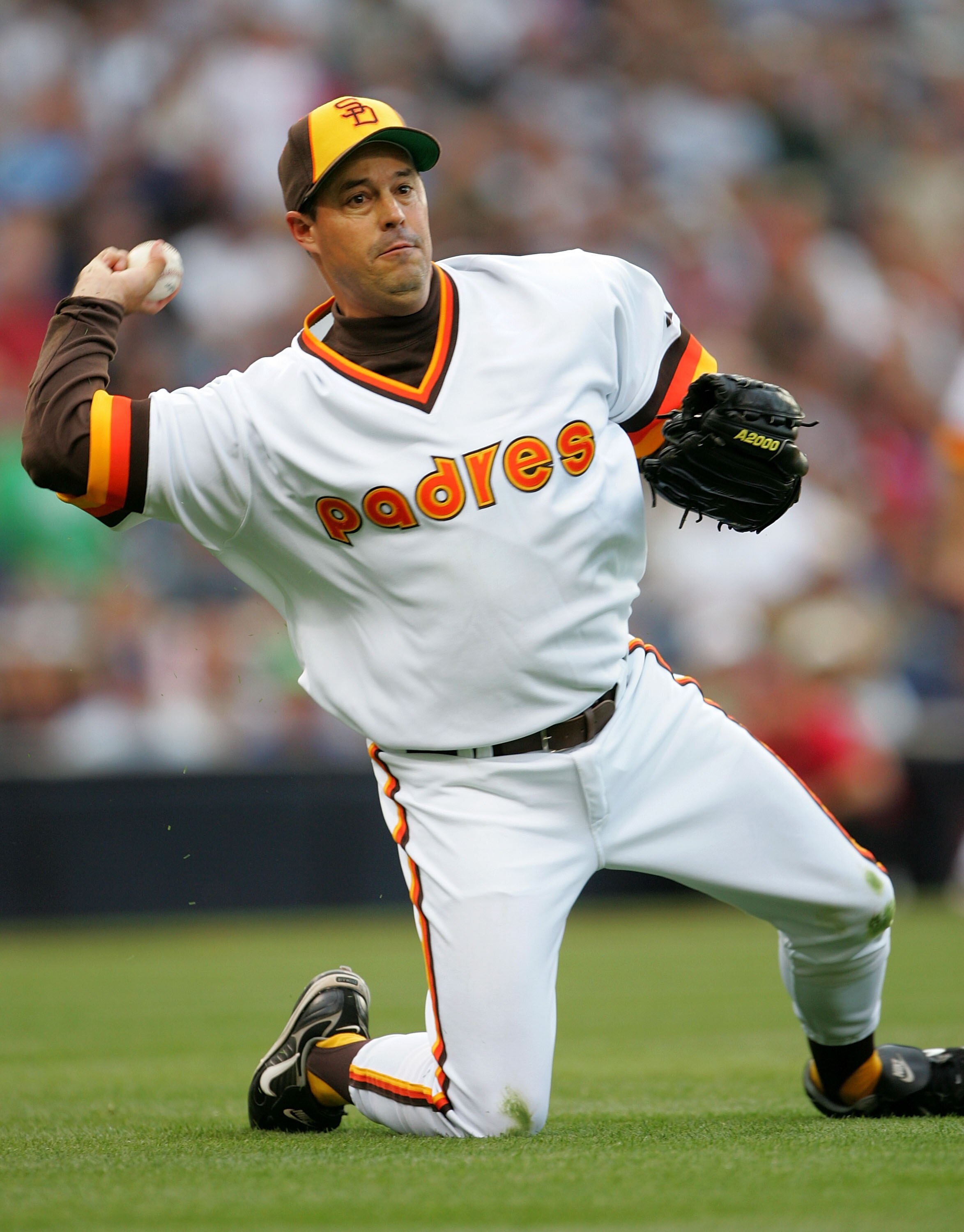 SAN DIEGO - JUNE 22:  Pitcher Greg Maddux #30 of the San Diego Padres throws to first from his knees after fielding a bunt against the Boston Red Sox on June 22, 2007 at Petco Park in San Diego, California.  (Photo by Stephen Dunn/Getty Images)