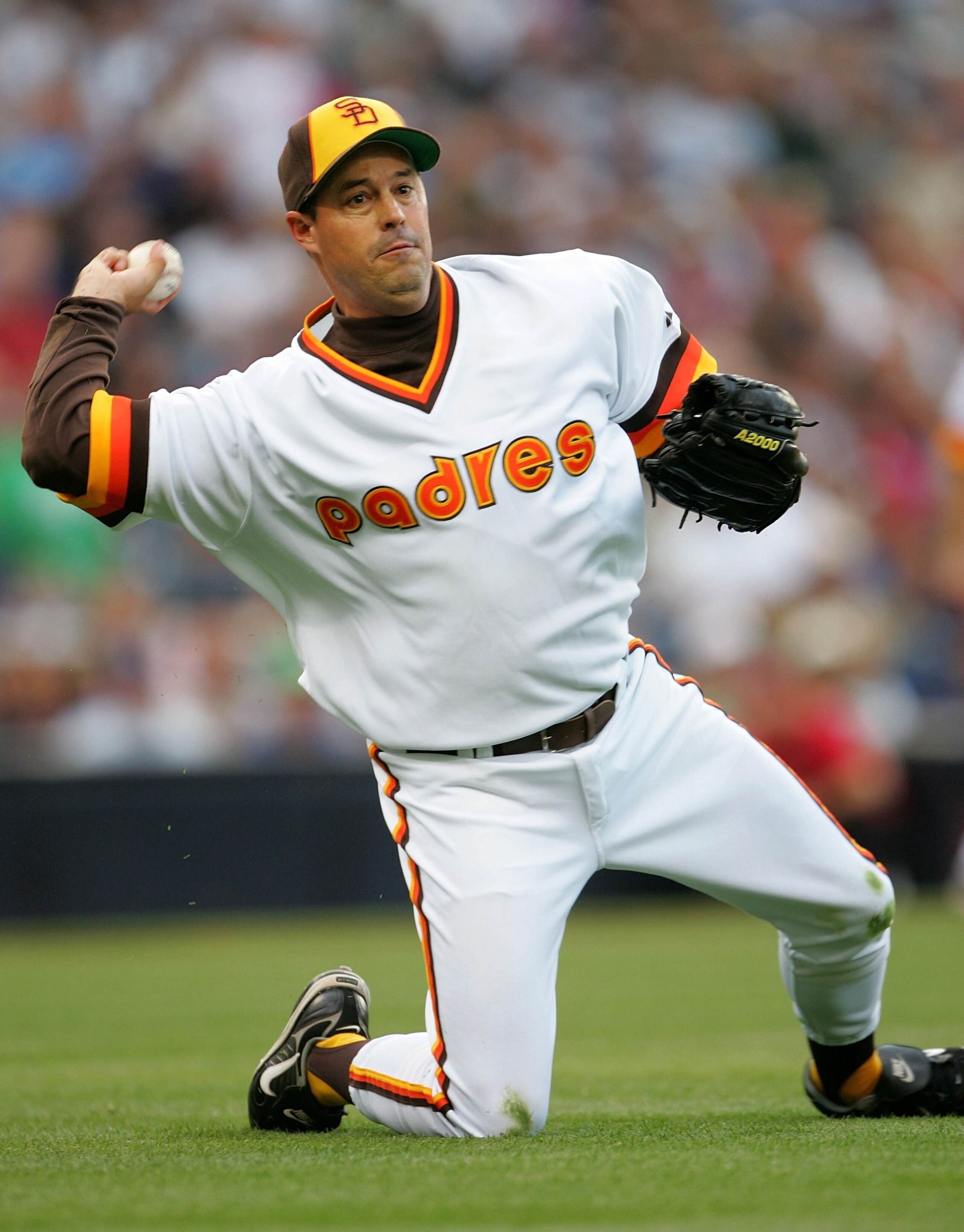 SAN DIEGO - JUNE 22:  Pitcher Greg Maddux #30 of the San Diego Padres throws to first from his knees after fielding a bunt against the Boston Red Sox on June 22, 2007 at Petco Park in San Diego, California.  (Photo by Stephen Dunn/Getty Images)