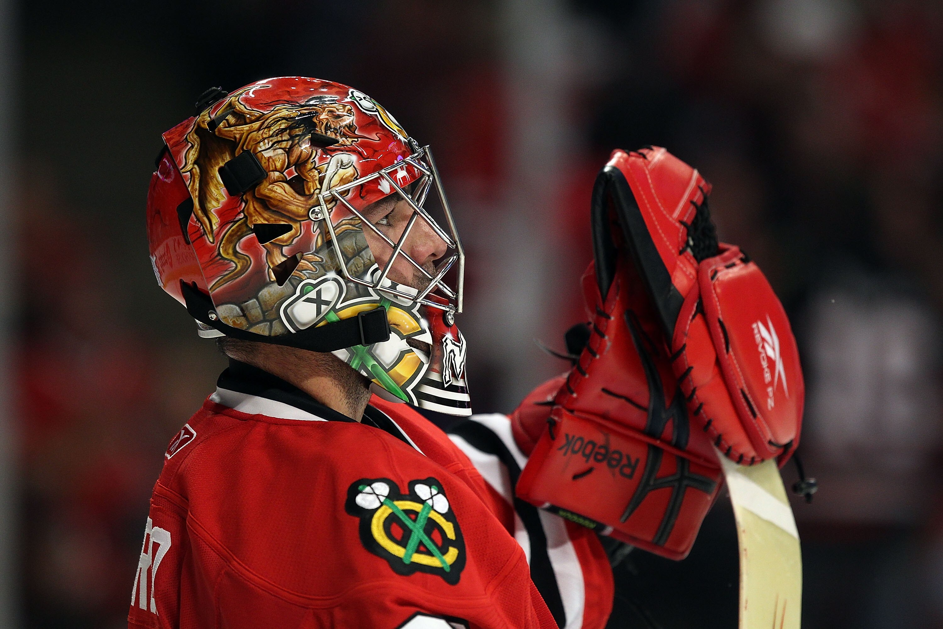 CHICAGO - OCTOBER 09: Marty Turco #30 of the Chicago Blackhawks takes a break in the action against the Detroit Red Wings during the Blackhawks season home opening game at the United Center on October 9, 2010 in Chicago, Illinois. The Red Wings defeated t