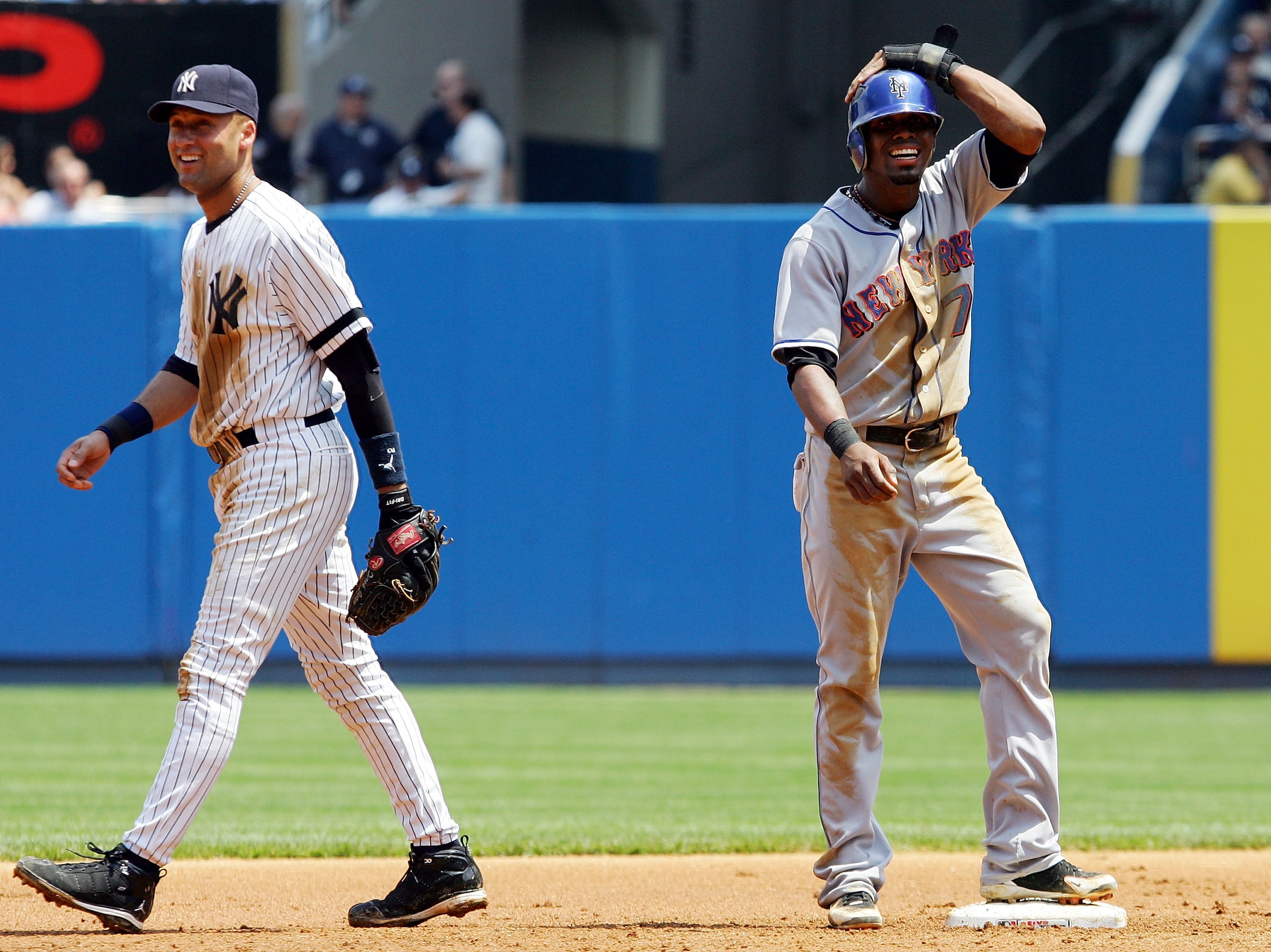 NEW YORK - JUNE 16:  Derek Jeter #2 of the New York Yankees and Jose Reyes #7 of the New York Mets have a laugh during their game on June 16, 2007 at Yankee Stadium in the Bronx borough of New York City.  (Photo by Jim McIsaac/Getty Images)