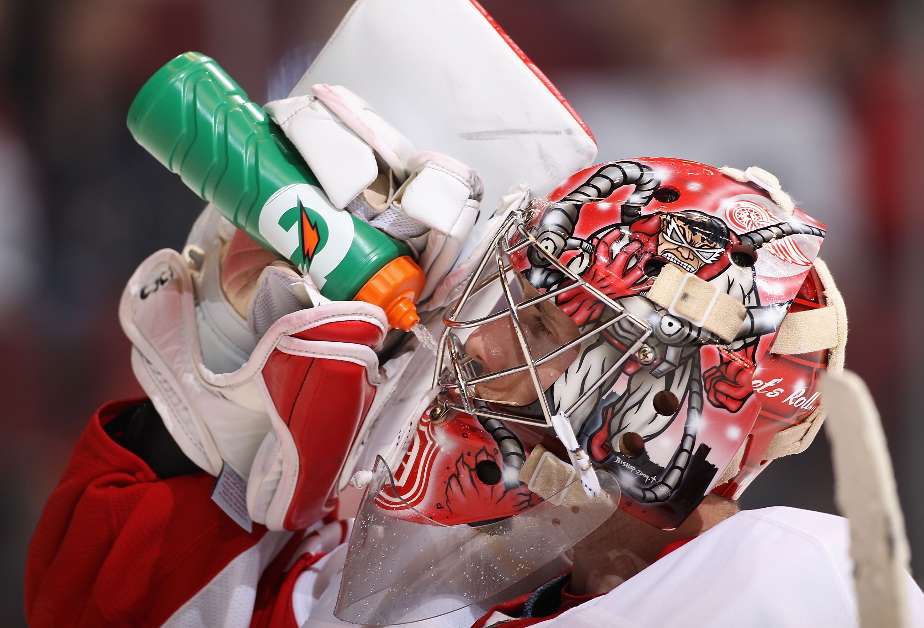 GLENDALE, AZ - OCTOBER 16:  Goaltender Jimmy Howard #35 of the Detroit Red Wings drinks water during a break from the NHL game against the Phoenix Coyotes at Jobing.com Arena on October16, 2010 in Glendale, Arizona.  The Red Wings defeated the Coyotes 2-1