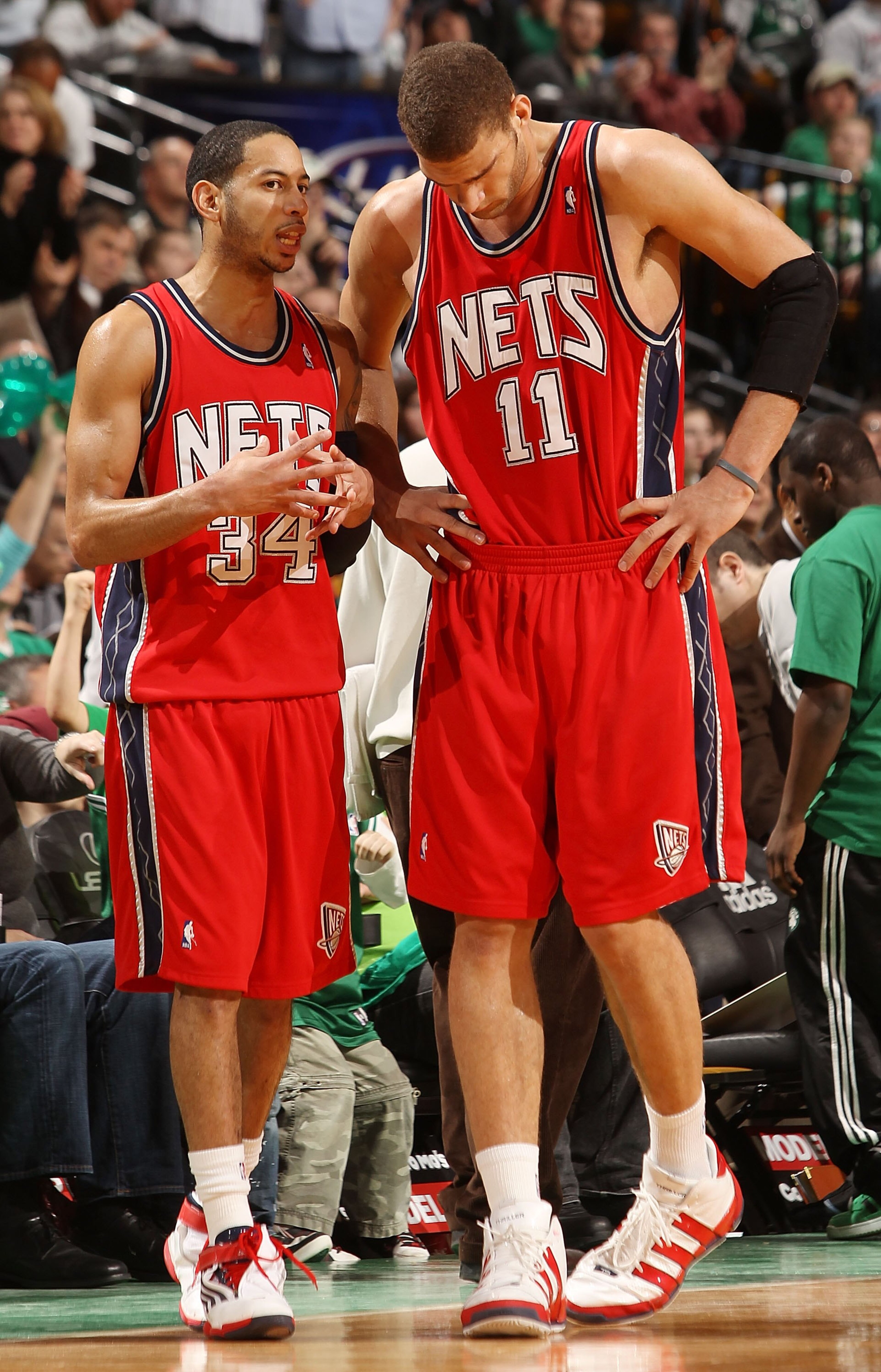 BOSTON - FEBRUARY 27: Devin Harris #34 of the New Jersey Nets talks with Brook Lopez #11 during a time out against the Boston Celtics at the TD Garden on February 27, 2010 in Boston, Massachusetts. The Nets defeated the Celtics 104-96. NOTE TO USER: Use BOSTON - FEBRUARY 27: Devin Harris #34 of the New Jersey Nets talks with Brook Lopez #11 during a time out against the Boston Celtics at the TD Garden on February 27, 2010 in Boston, Massachusetts. The Nets defeated the Celtics 104-96. NOTE TO USER: Use