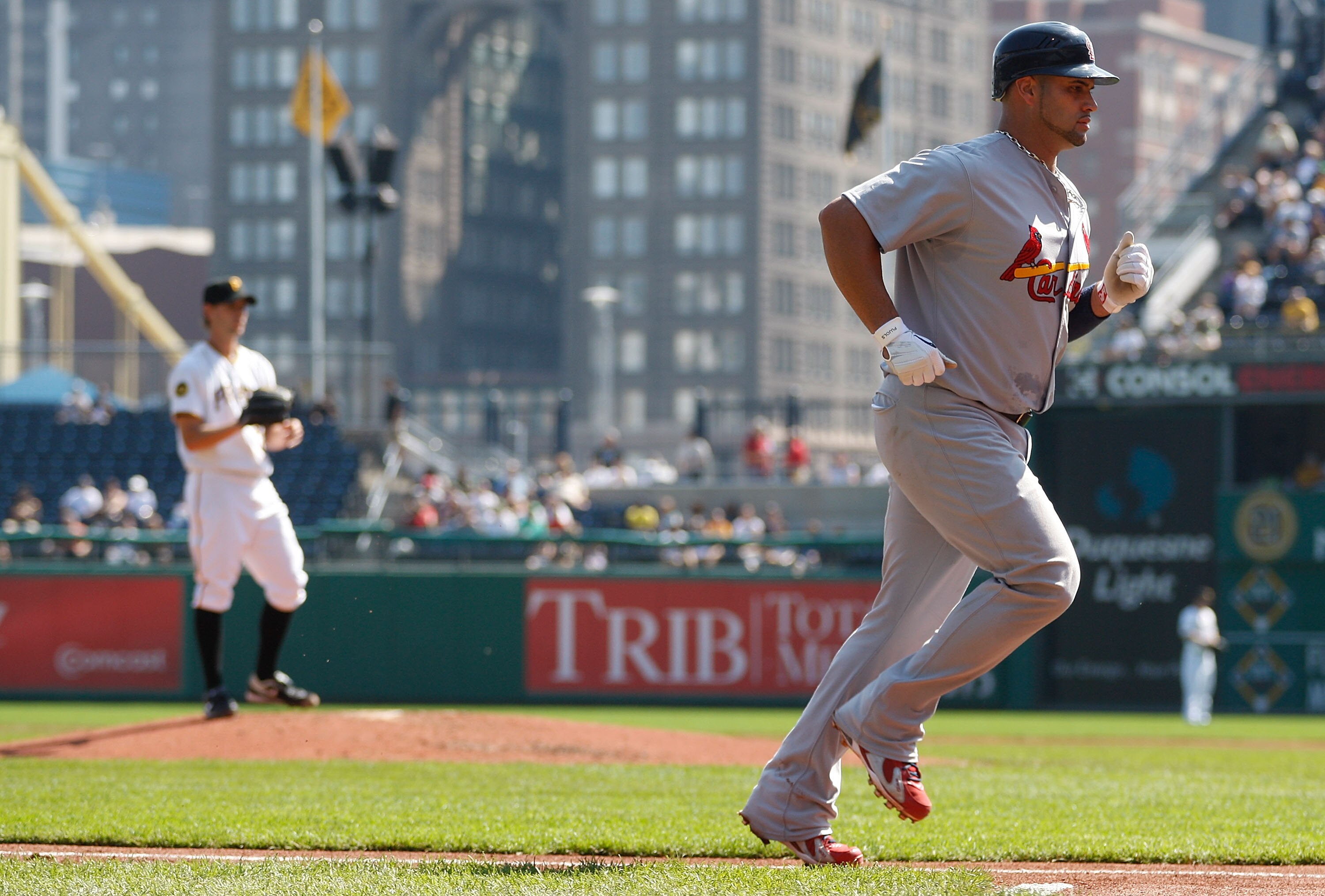 PITTSBURGH - SEPTEMBER 23:  Albert Pujols #5 of the St Louis Cardinals jogs to home plate after hitting a two run home run off of Brian Burres #71 the Pittsburgh Pirates during the game on September 23, 2010 at PNC Park in Pittsburgh, Pennsylvania.  (Phot
