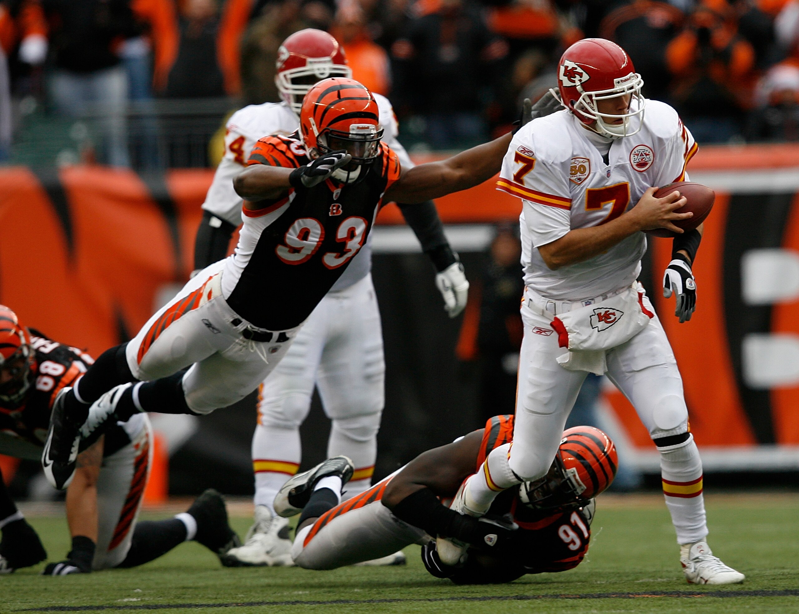 CINCINNATI - DECEMBER 27: Matt Cassel #7 of the Kansas City Chiefs is sacked by Michael Johnson #93 and Robert Geathers #91 of the Cincinnati Bengals in their NFL game at Paul Brown Stadium December 27, 2009 in Cincinnati, Ohio.    (Photo by John Sommers