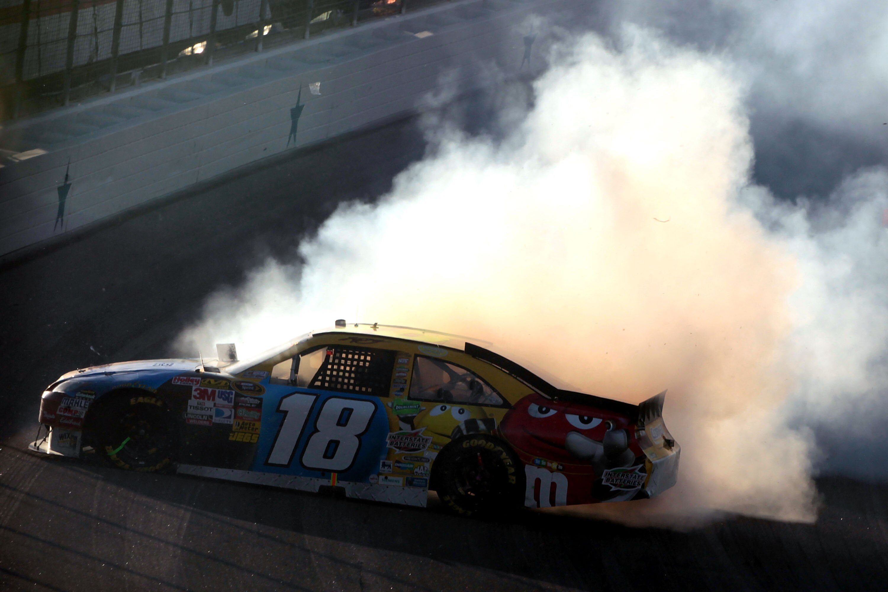 FORT WORTH, TX - NOVEMBER 07:  Kyle Busch, driver of the #18 M&M's Toyota, crashes during the NASCAR Sprint Cup Series AAA Texas 500 at Texas Motor Speedway on November 7, 2010 in Fort Worth, Texas.  (Photo by Jamie Squire/Getty Images)