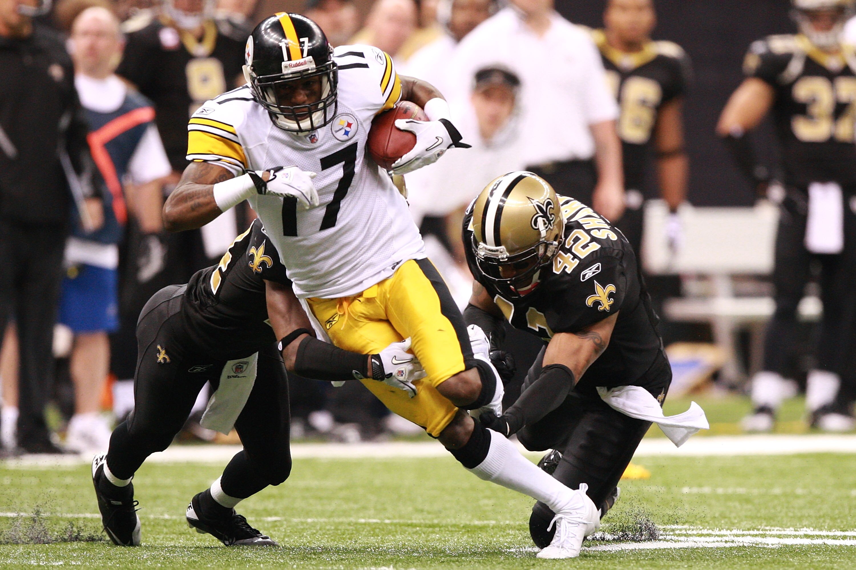 NEW ORLEANS - OCTOBER 31:  Mike Wallace #17 of the Pittsburgh Steelers is tackled by Darren Sharper #42 of the New Orleans Saints during their game at Louisiana Superdome on October 31, 2010 in New Orleans, Louisiana.  The Saints won 20-10 over the Steele