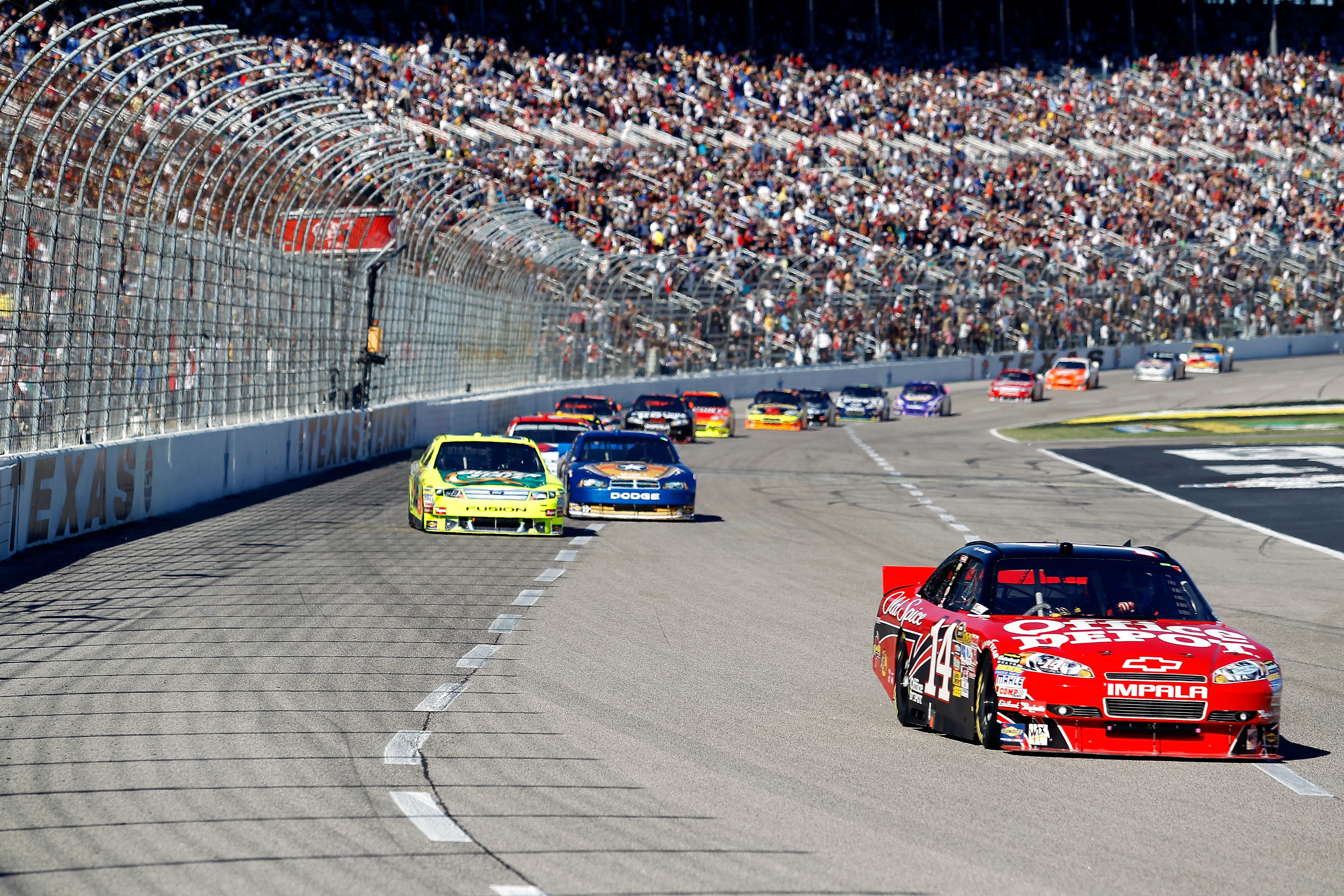 FORT WORTH, TX - NOVEMBER 07:  Tony Stewart, driver of the #14 Old Spice/Office Depot Chevrolet, leads a group of cars during the NASCAR Sprint Cup Series AAA Texas 500 at Texas Motor Speedway on November 7, 2010 in Fort Worth, Texas.  (Photo by Todd Wars