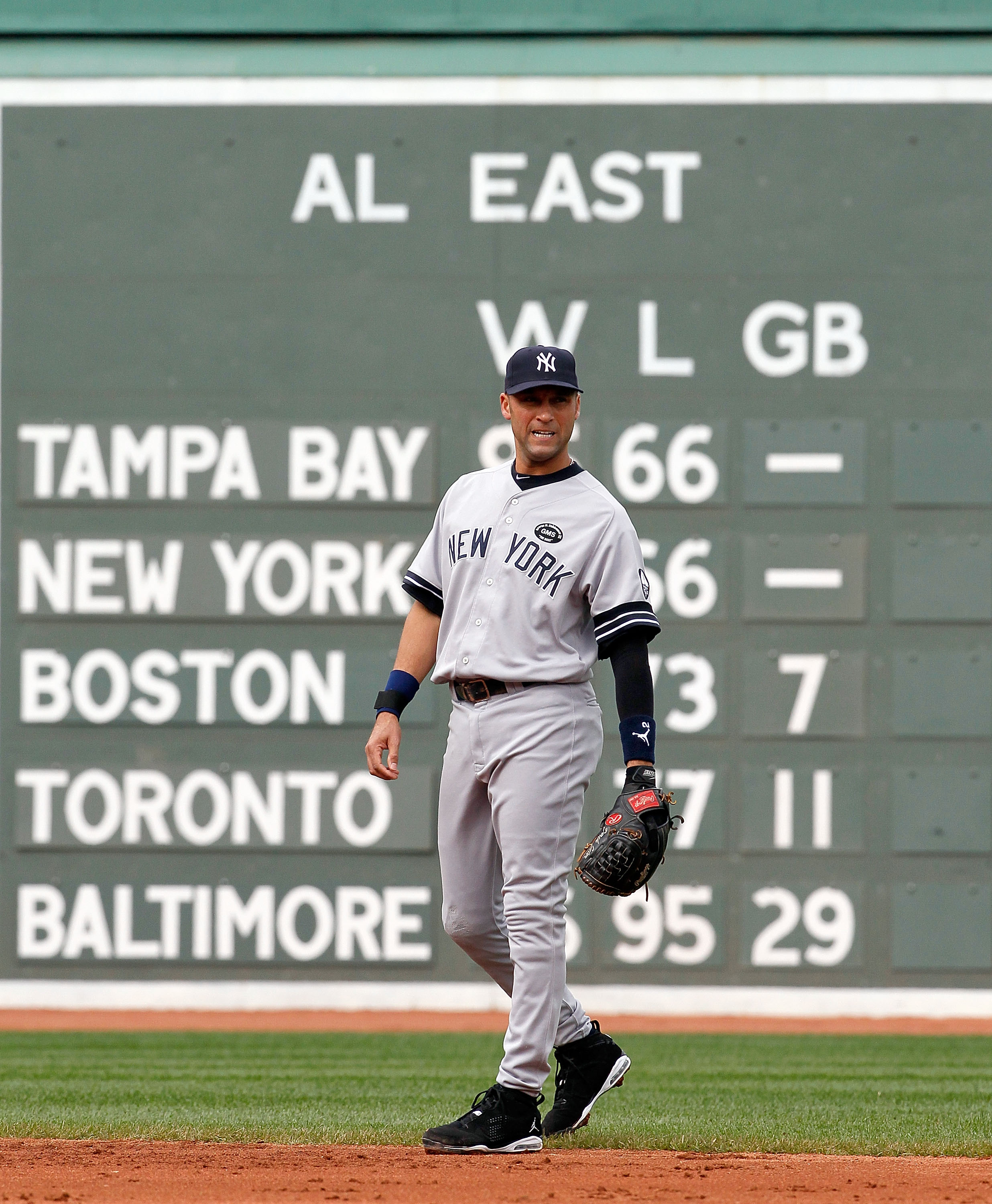 BOSTON - OCTOBER 3:  Derek Jeter #2 of the New York Yankees walks into position during a game against the Boston Red Sox at Fenway Park, October 3, 2010, in Boston, Massachusetts. (Photo by Jim Rogash/Getty Images)