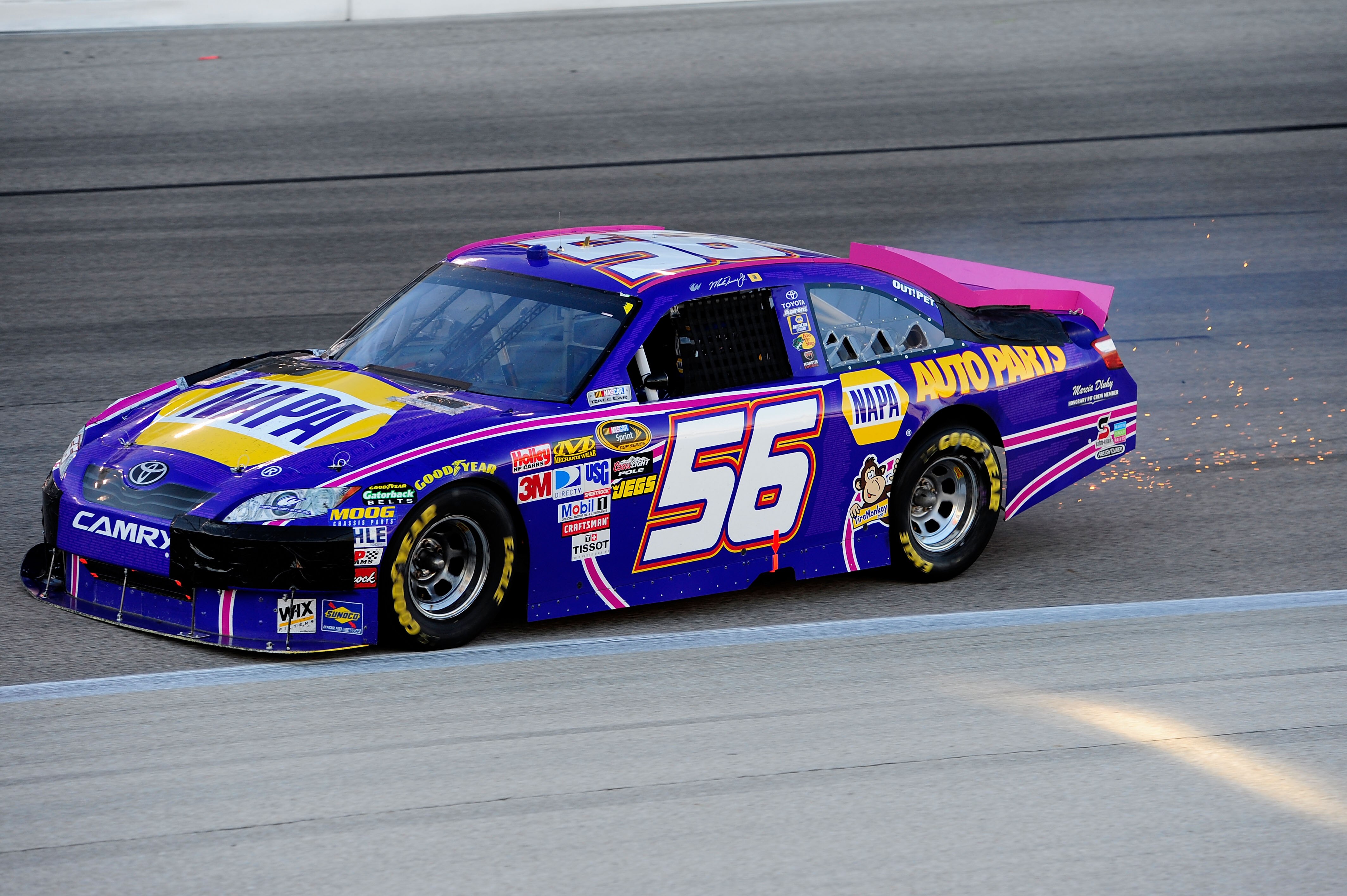 FORT WORTH, TX - NOVEMBER 07:  Martin Truex Jr. drives the #56 NAPA Toyota as sparks fly after an incident in the NASCAR Sprint Cup Series AAA Texas 500 at Texas Motor Speedway on November 7, 2010 in Fort Worth, Texas.  (Photo by Robert Laberge/Getty Imag