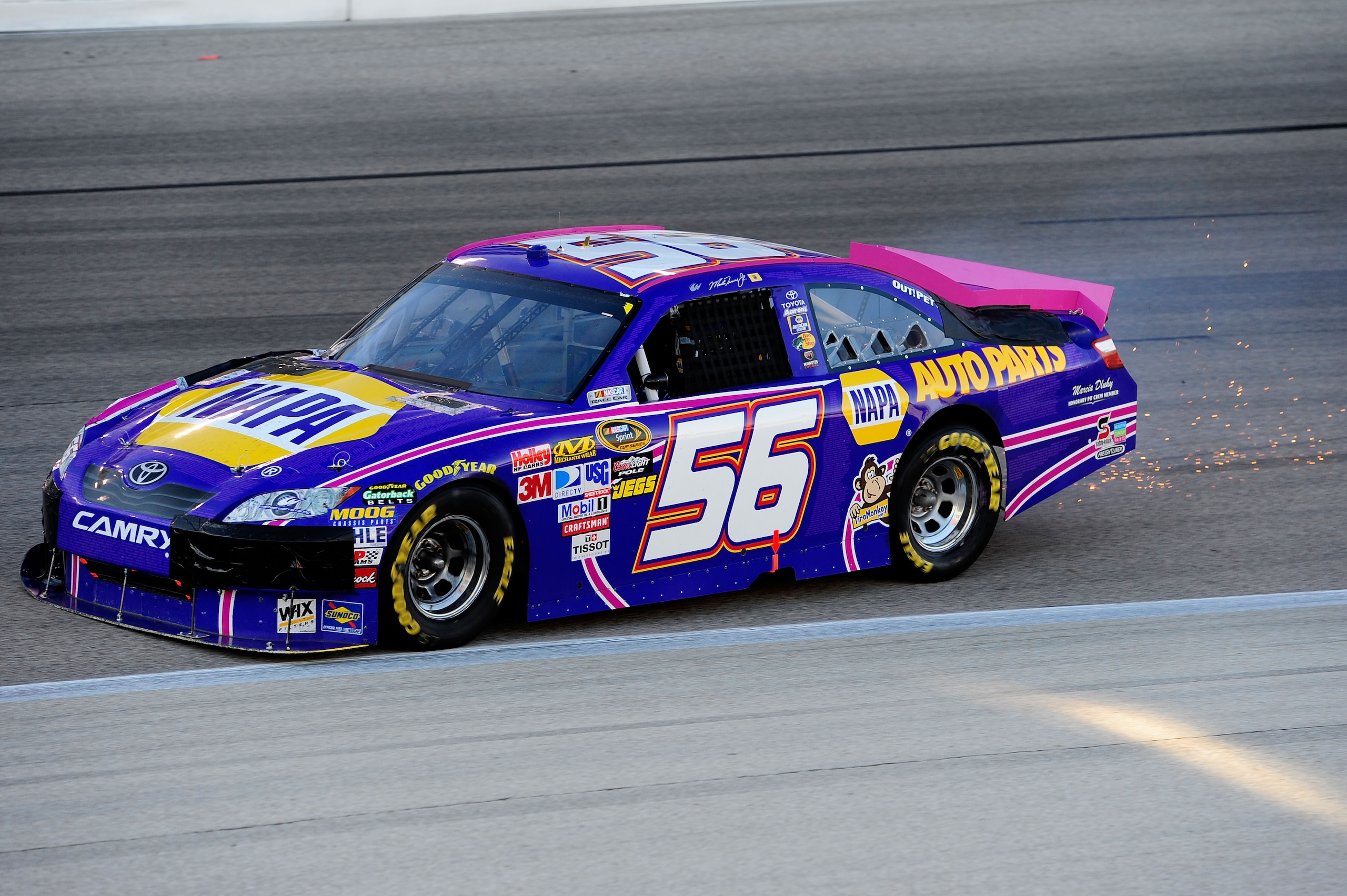 FORT WORTH, TX - NOVEMBER 07:  Martin Truex Jr. drives the #56 NAPA Toyota as sparks fly after an incident in the NASCAR Sprint Cup Series AAA Texas 500 at Texas Motor Speedway on November 7, 2010 in Fort Worth, Texas.  (Photo by Robert Laberge/Getty Imag