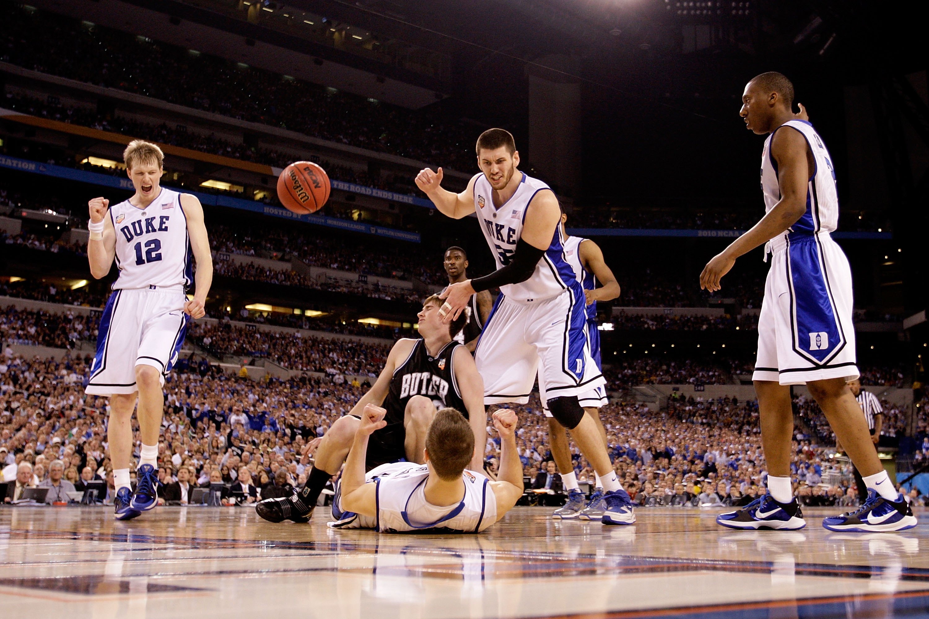 INDIANAPOLIS - APRIL 05:  (L-R) Kyle Singler #12, Jon Scheyer #30, Brian Zoubek #55 and Nolan Smith #2 of the Duke Blue Devils celebrate after Scheyer drew a charging foul against Gordon Hayward #20 of the Butler Bulldogs during the 2010 NCAA Division I M