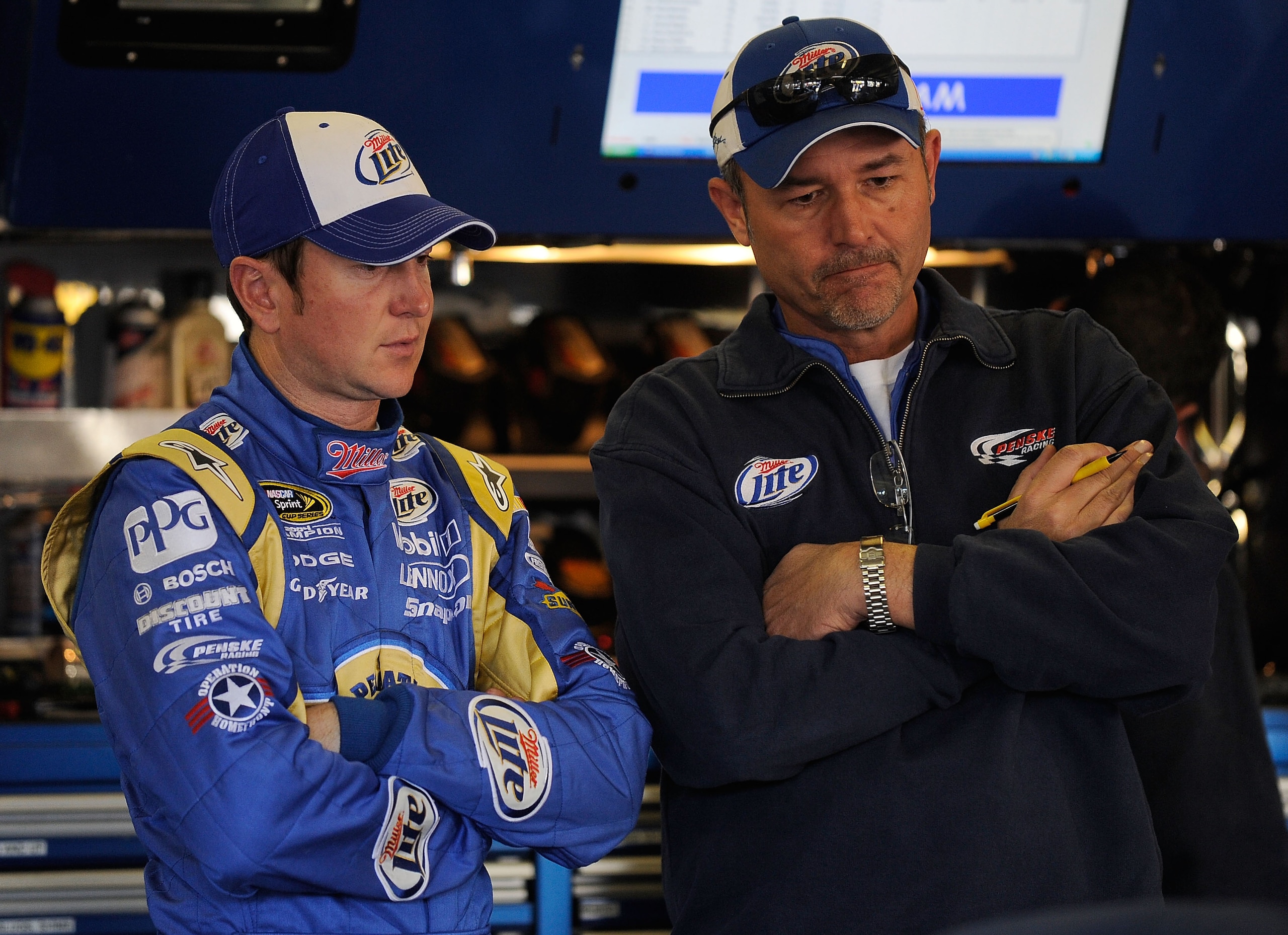 FORT WORTH, TX - NOVEMBER 06:  Kurt Busch (L), driver of the #2 Operation Home Front/Miller Lite Dodge, talks to crew chief Steve Addington (R) during practice for the NASCAR Sprint Cup Series AAA Texas 500 at Texas Motor Speedway on November 6, 2010 in F