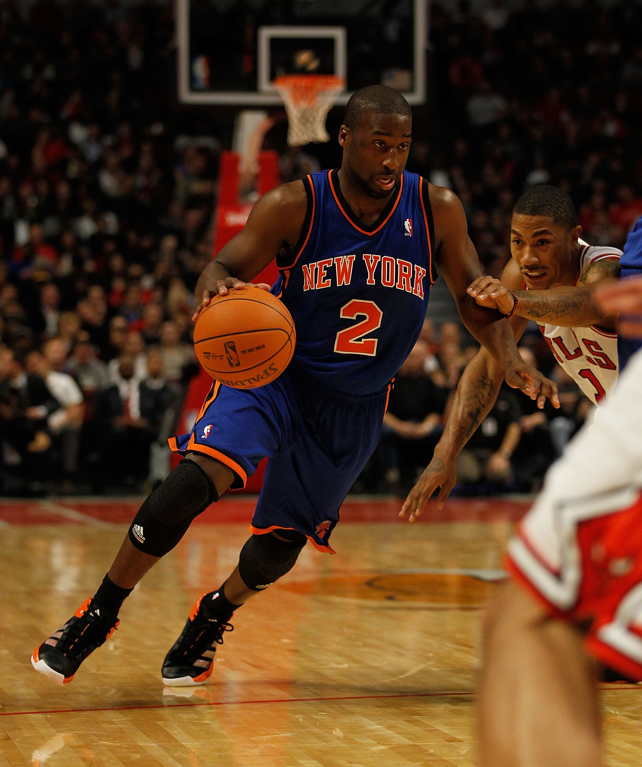 CHICAGO - NOVEMBER 04: Raymond Felton #2 of the New York Knicks drives around Derrick Rose #1 of the Chicago Bulls at the United Center on November 4, 2010 in Chicago, Illinois. The Knicks defeated the Bulls 120-112. NOTE TO USER: User expressly acknowled