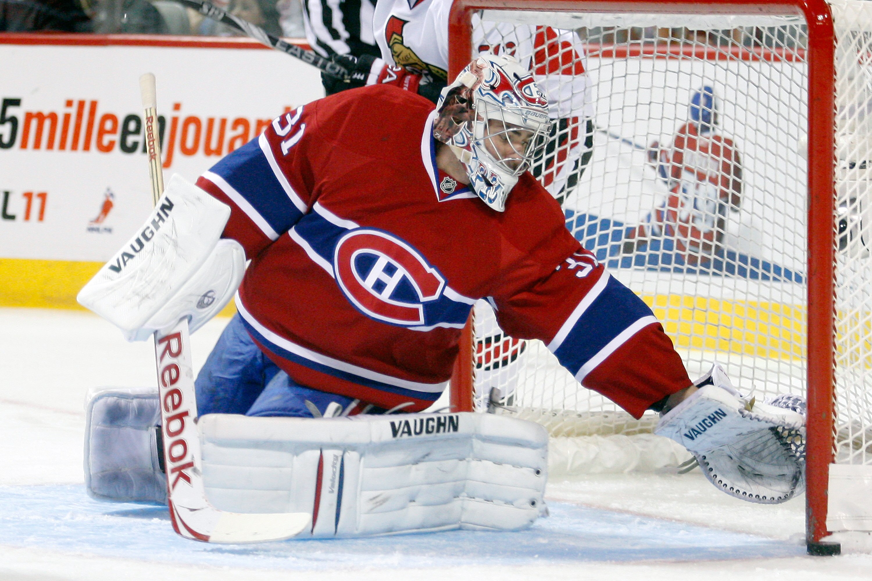 MONTREAL- NOVEMBER 6:  Carey Price #31 of the Montreal Canadiens reaches to stop the puck that hit the post during the NHL game against the Ottawa Senators at the Bell Centre on November 6, 2010 in Montreal, Quebec, Canada.  (Photo by Richard Wolowicz/Get