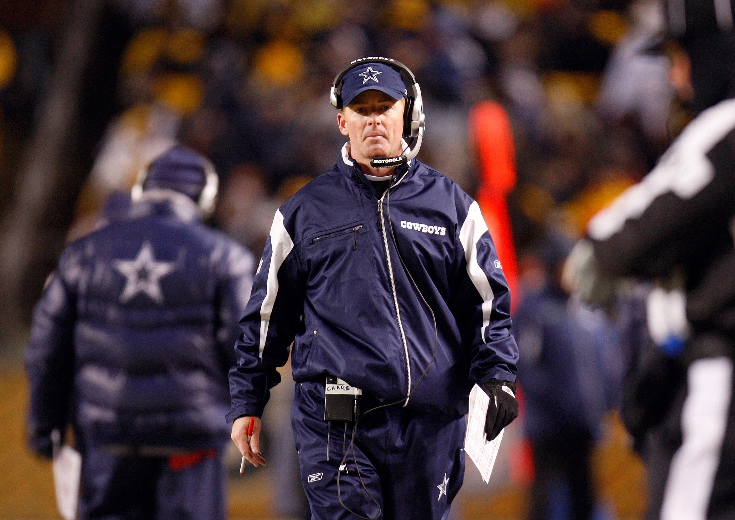 PITTSBURGH - DECEMBER 7:  Offensive Coordinator Jason Garrett of the Dallas Cowboys looks on from the sideline during their NFL game against the Pittsburgh Steelers on December 7, 2008 at Heinz Field in Pittsburgh, Pennsylvania. The Steelers defeated the