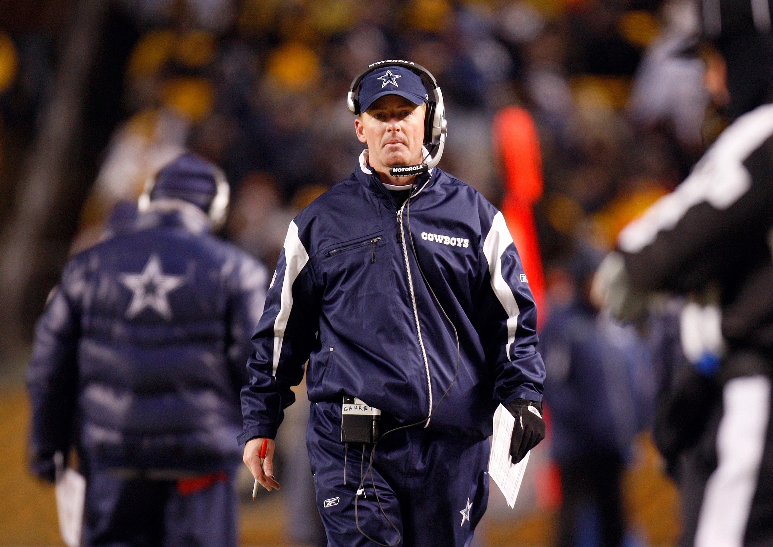 PITTSBURGH - DECEMBER 7:  Offensive Coordinator Jason Garrett of the Dallas Cowboys looks on from the sideline during their NFL game against the Pittsburgh Steelers on December 7, 2008 at Heinz Field in Pittsburgh, Pennsylvania. The Steelers defeated the