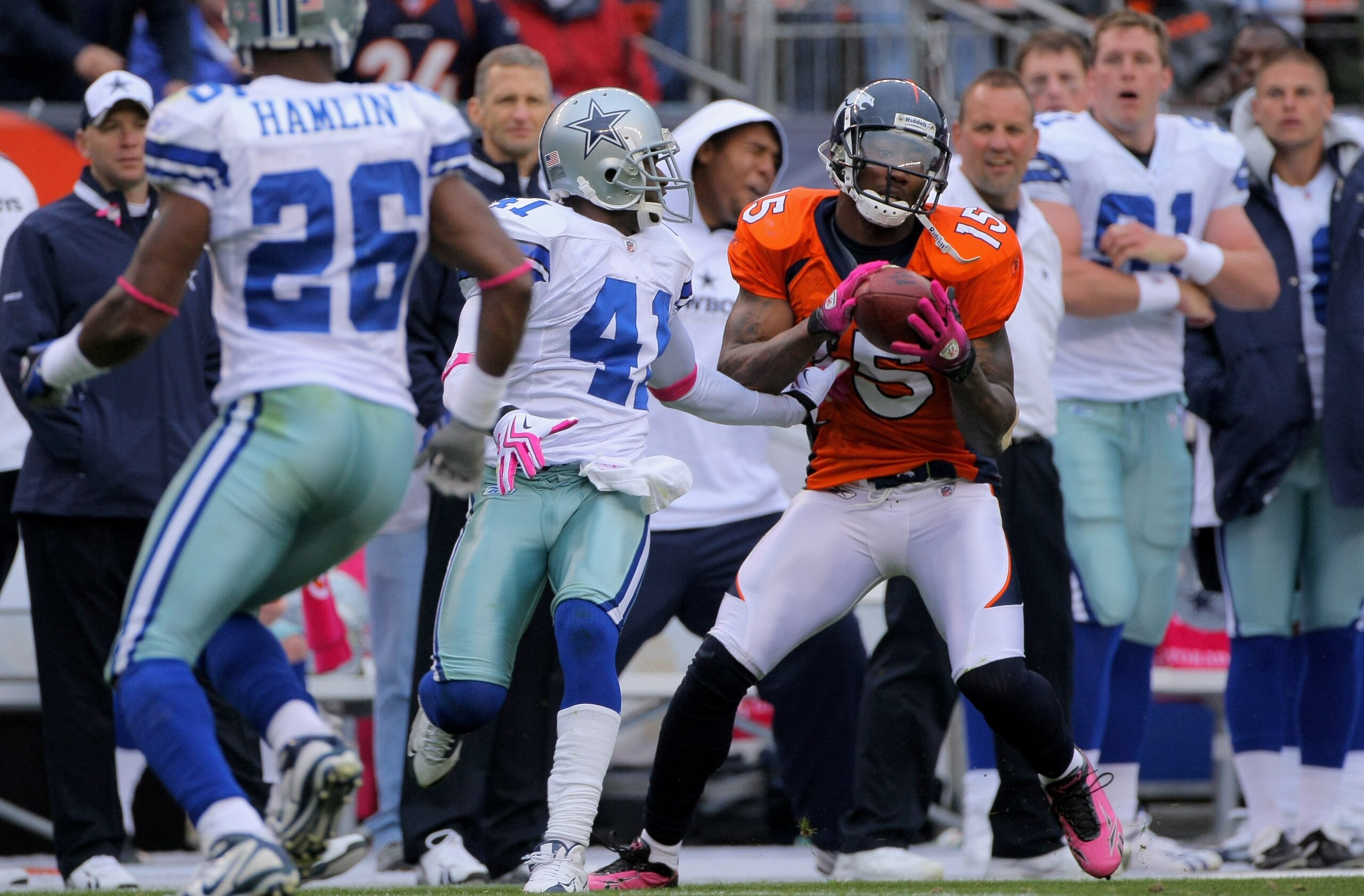 DENVER - OCTOBER 04:  Brandon Marshall #15 of the Denver Broncos makes the game winning 51 yard touchdown reception as Terence Newman #41 of the Dallas Cowboys defends with 2:47 remaining in the fourth quarter during NFL action at Invesco Field at Mile Hi