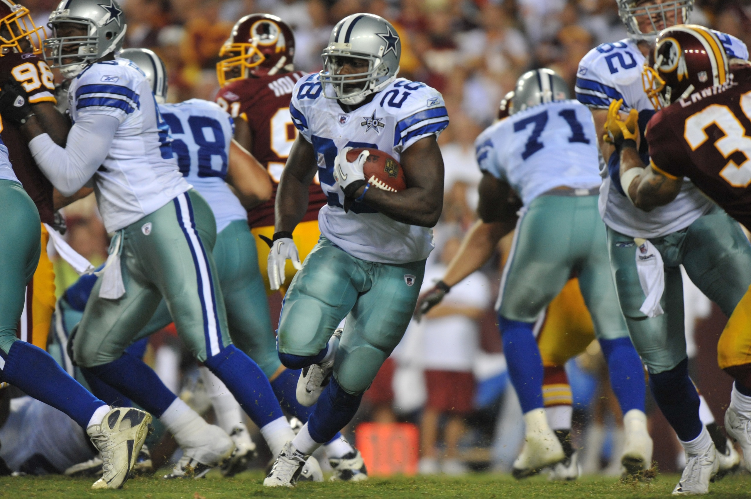LANDOVER - SEPTEMBER 12:  Felix Jones #28 of the Dallas Cowboys runs the ball during the NFL season opener against the Washington Redskins at FedExField on September 12, 2010 in Landover, Maryland. The Redskins defeated the Cowboys 13-7. (Photo by Larry F