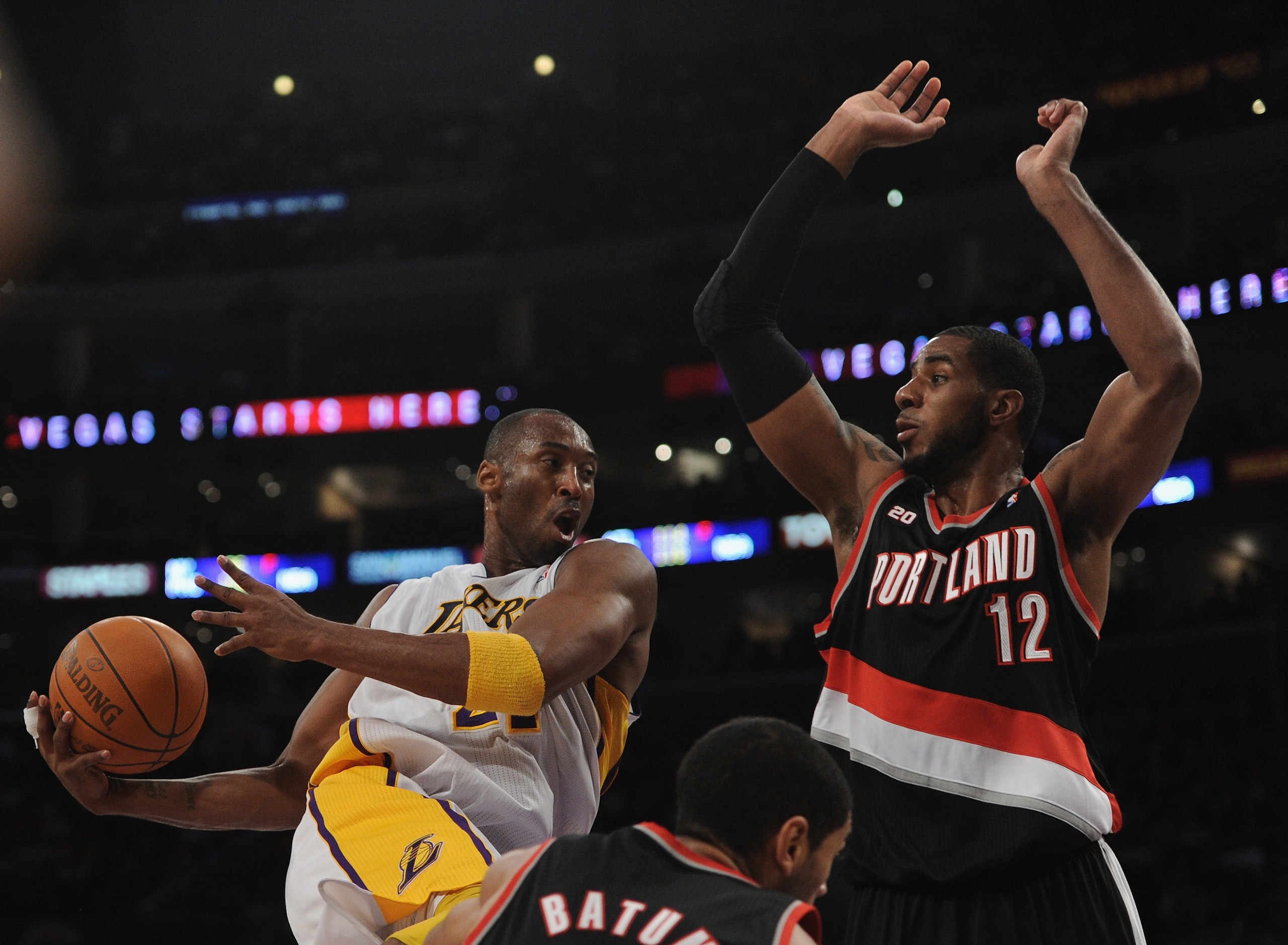 LOS ANGELES, CA - NOVEMBER 07:  Kobe Bryant #24 of the Los Angeles Lakers cuts in for a layup in front of LaMarcus Aldridge #12 and Nicolas Batum #88 of the Portland Trail Blazers during the first half at the Staples Center on November 7, 2010 in Los Ange
