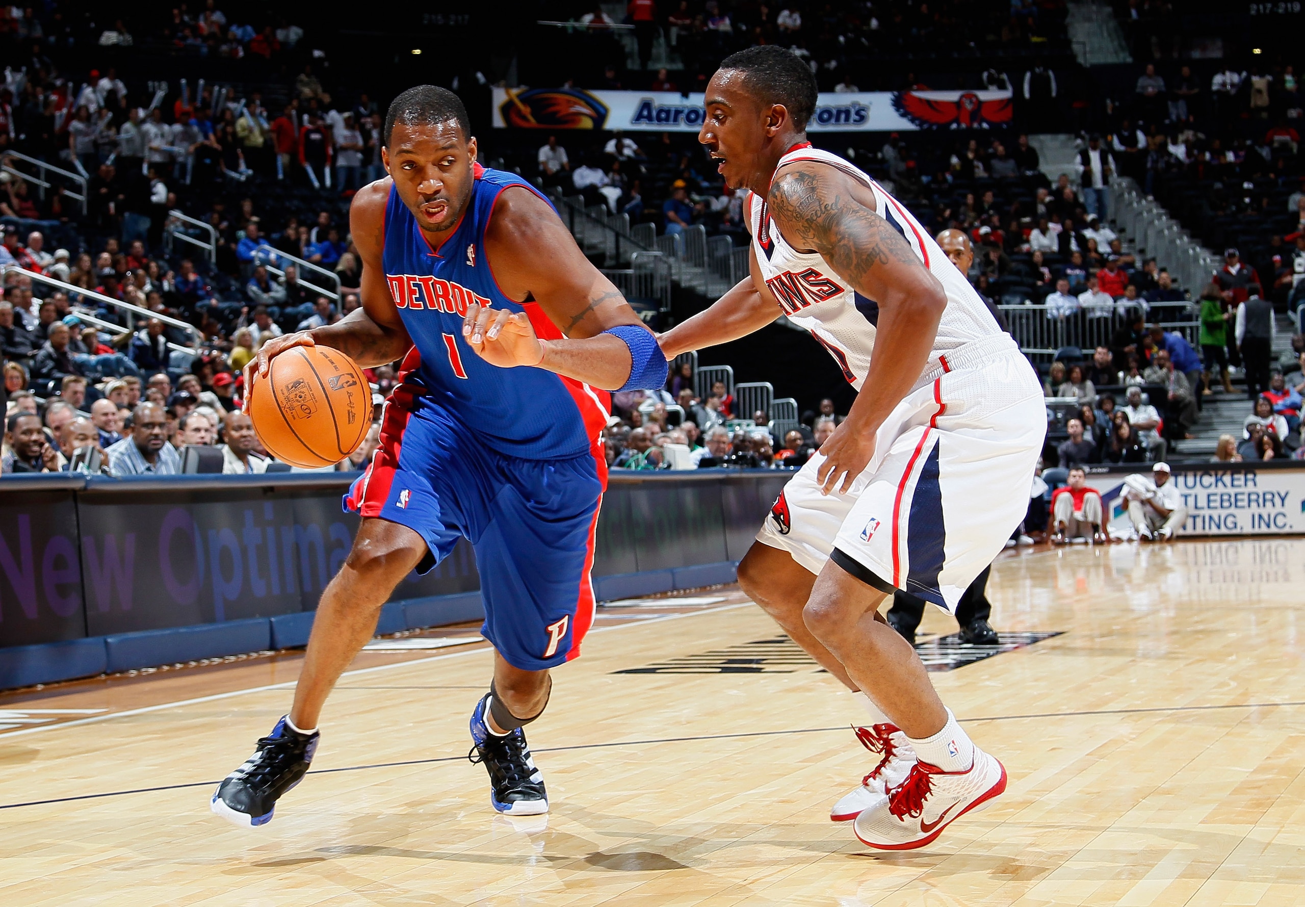 ATLANTA - NOVEMBER 03: Tracy McGrady #1 of the Detroit Pistons drives against Jeff Teague #0 of the Atlanta Hawks at Philips Arena on November 3, 2010 in Atlanta, Georgia. NOTE TO USER: User expressly acknowledges and agrees that, by downloading and/or ATLANTA - NOVEMBER 03: Tracy McGrady #1 of the Detroit Pistons drives against Jeff Teague #0 of the Atlanta Hawks at Philips Arena on November 3, 2010 in Atlanta, Georgia. NOTE TO USER: User expressly acknowledges and agrees that, by downloading and/or