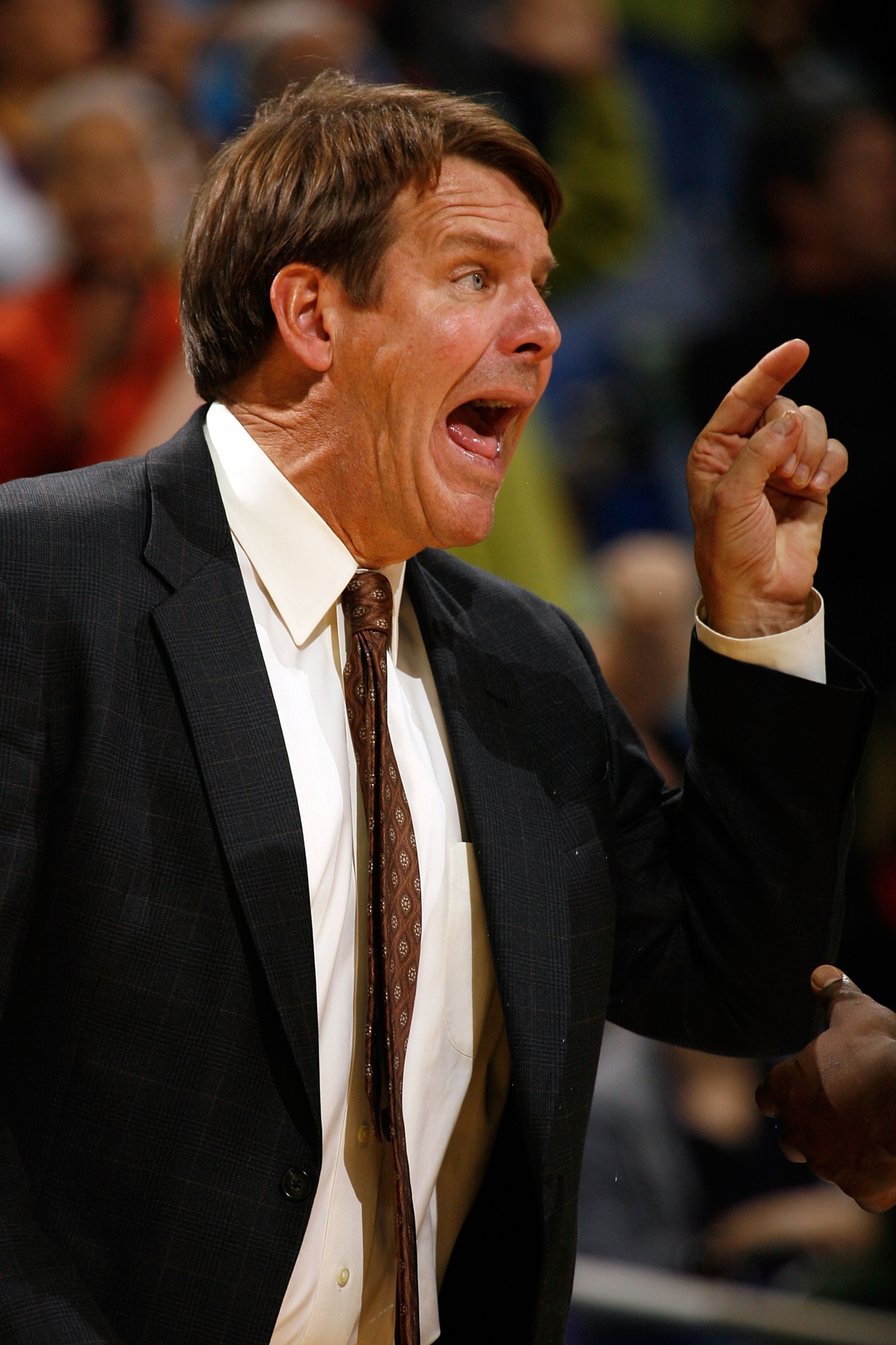 NEW ORLEANS - DECEMBER 18:  Assistant Coach Tim Floyd of the New Orleans Hornets yells to a player against the Denver Nuggets at New Orleans Arena on December 18, 2009 in New Orleans, Louisiana.  The Hornets defeated the Nuggets 98-92.   NOTE TO USER: Use
